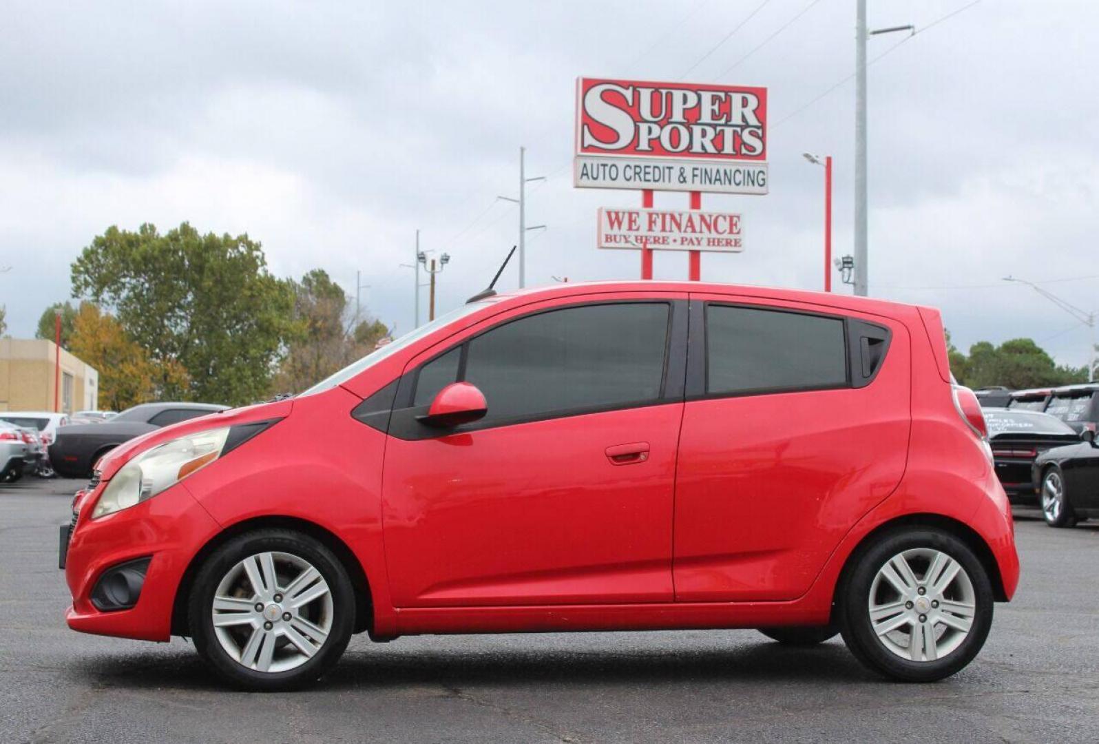 2013 Red Chevrolet Spark LS Manual (KL8CA6S95DC) with an 1.2L L4 16V DOHC engine, 5-Speed Manual transmission, located at 4301 NW 39th , Oklahoma City, OK, 73112, (405) 949-5600, 35.512135, -97.598671 - Photo#7