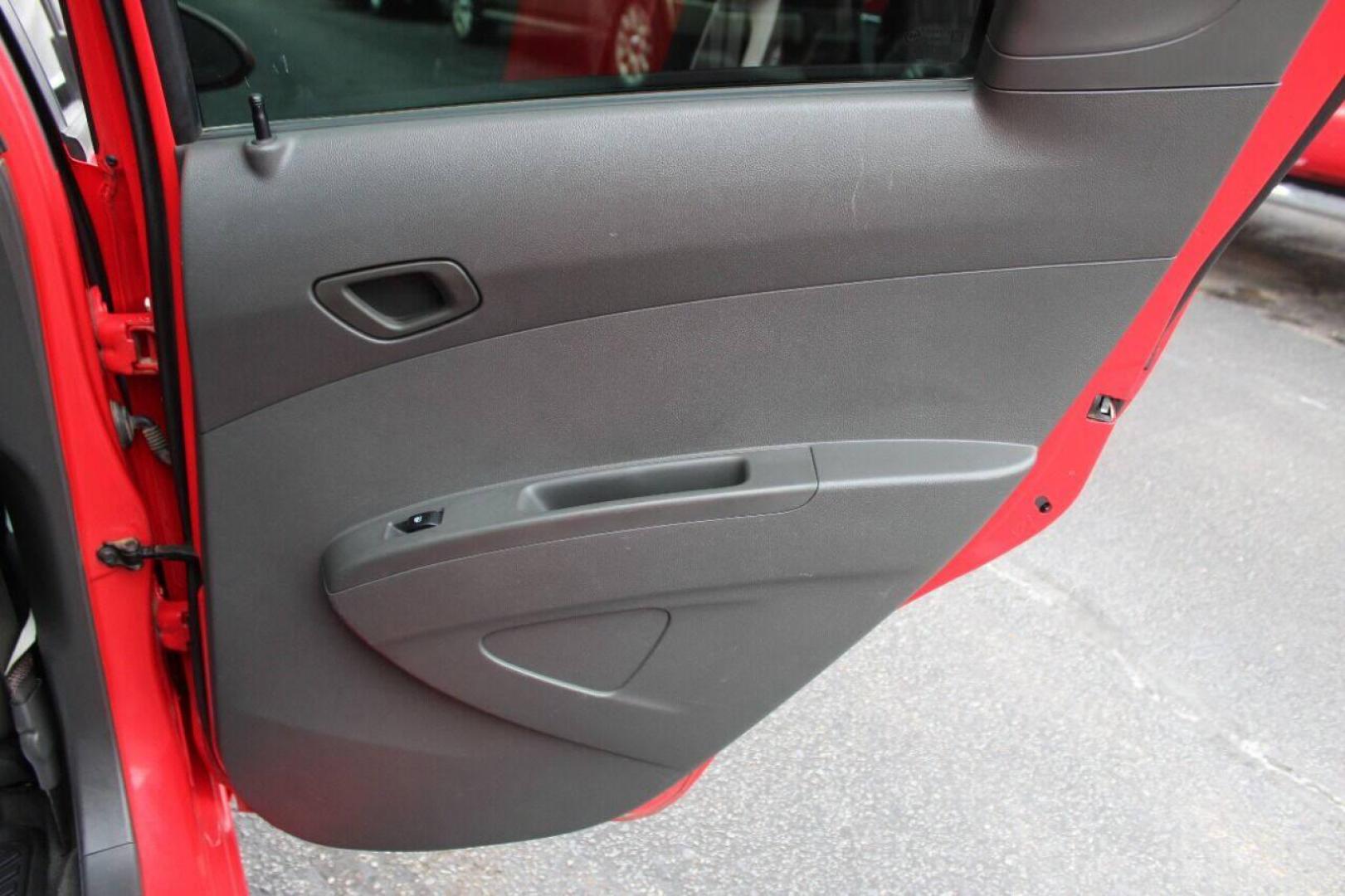 2013 Red Chevrolet Spark LS Manual (KL8CA6S95DC) with an 1.2L L4 16V DOHC engine, 5-Speed Manual transmission, located at 4301 NW 39th , Oklahoma City, OK, 73112, (405) 949-5600, 35.512135, -97.598671 - Photo#11