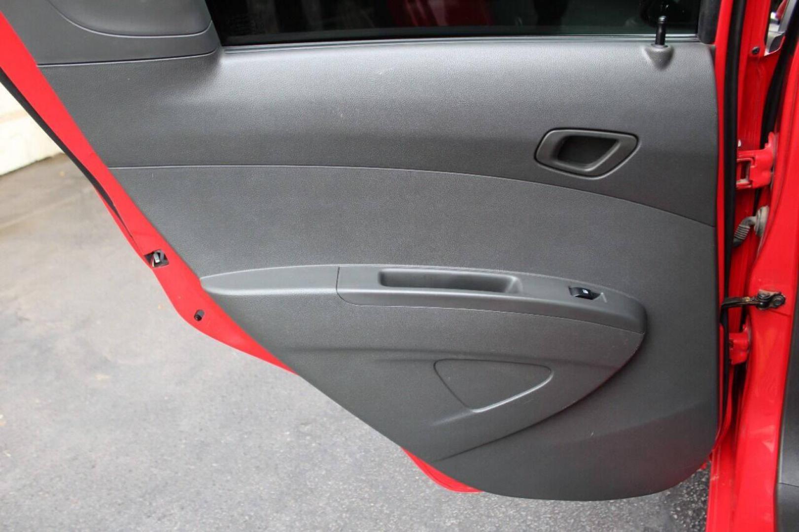 2013 Red Chevrolet Spark LS Manual (KL8CA6S95DC) with an 1.2L L4 16V DOHC engine, 5-Speed Manual transmission, located at 4301 NW 39th , Oklahoma City, OK, 73112, (405) 949-5600, 35.512135, -97.598671 - Photo#14