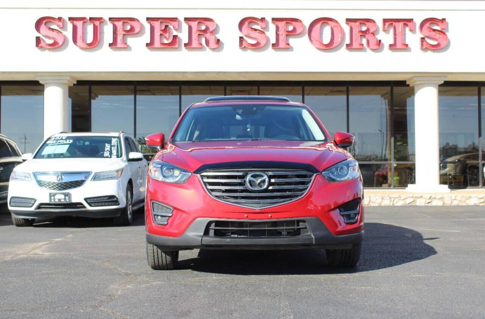 2016 Burgundy Mazda CX-5 Grand Touring AWD (JM3KE4DY9G0) with an 2.5L L4 DOHC 16V engine, 6-Speed Automatic transmission, located at 4301 NW 39th , Oklahoma City, OK, 73112, (405) 949-5600, 35.512135, -97.598671 - NO DRIVERS LICENSE - NO FULL COVERAGE INSURANCE - NO CREDIT CHECK. COME ON OVER TO SUPERSPORTS AND TAKE A LOOK AND TEST DRIVE. PLEASE GIVE US A CALL AT (405) 949-5600. NO LICENCIA DE MANEJAR - NO SEGURO DE COBERTURA TOTAL - NO VERIFICACION DE CREDITO. POR FAVOR VENGAN A SUPERSPORTS, ECH - Photo#2