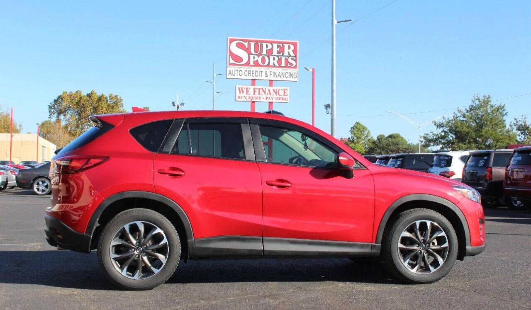 2016 Burgundy Mazda CX-5 Grand Touring AWD (JM3KE4DY9G0) with an 2.5L L4 DOHC 16V engine, 6-Speed Automatic transmission, located at 4301 NW 39th , Oklahoma City, OK, 73112, (405) 949-5600, 35.512135, -97.598671 - NO DRIVERS LICENSE - NO FULL COVERAGE INSURANCE - NO CREDIT CHECK. COME ON OVER TO SUPERSPORTS AND TAKE A LOOK AND TEST DRIVE. PLEASE GIVE US A CALL AT (405) 949-5600. NO LICENCIA DE MANEJAR - NO SEGURO DE COBERTURA TOTAL - NO VERIFICACION DE CREDITO. POR FAVOR VENGAN A SUPERSPORTS, ECH - Photo#3