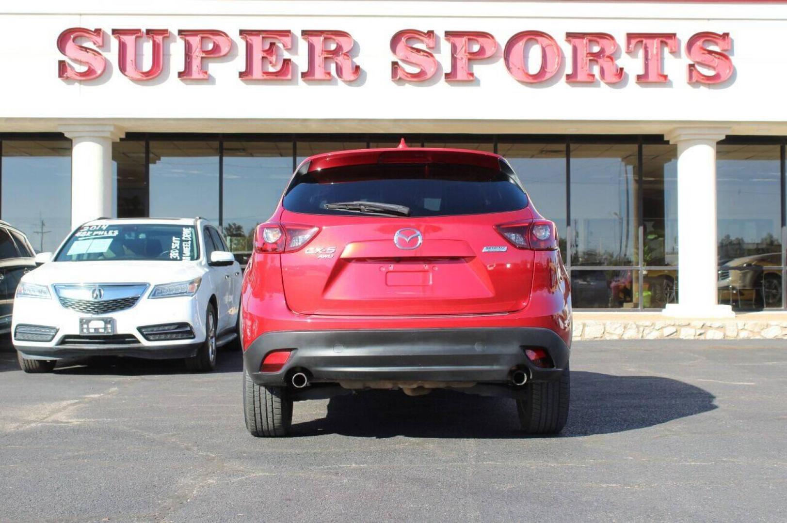 2016 Burgundy Mazda CX-5 Grand Touring AWD (JM3KE4DY9G0) with an 2.5L L4 DOHC 16V engine, 6-Speed Automatic transmission, located at 4301 NW 39th , Oklahoma City, OK, 73112, (405) 949-5600, 35.512135, -97.598671 - NO DRIVERS LICENSE - NO FULL COVERAGE INSURANCE - NO CREDIT CHECK. COME ON OVER TO SUPERSPORTS AND TAKE A LOOK AND TEST DRIVE. PLEASE GIVE US A CALL AT (405) 949-5600. NO LICENCIA DE MANEJAR - NO SEGURO DE COBERTURA TOTAL - NO VERIFICACION DE CREDITO. POR FAVOR VENGAN A SUPERSPORTS, ECH - Photo#4