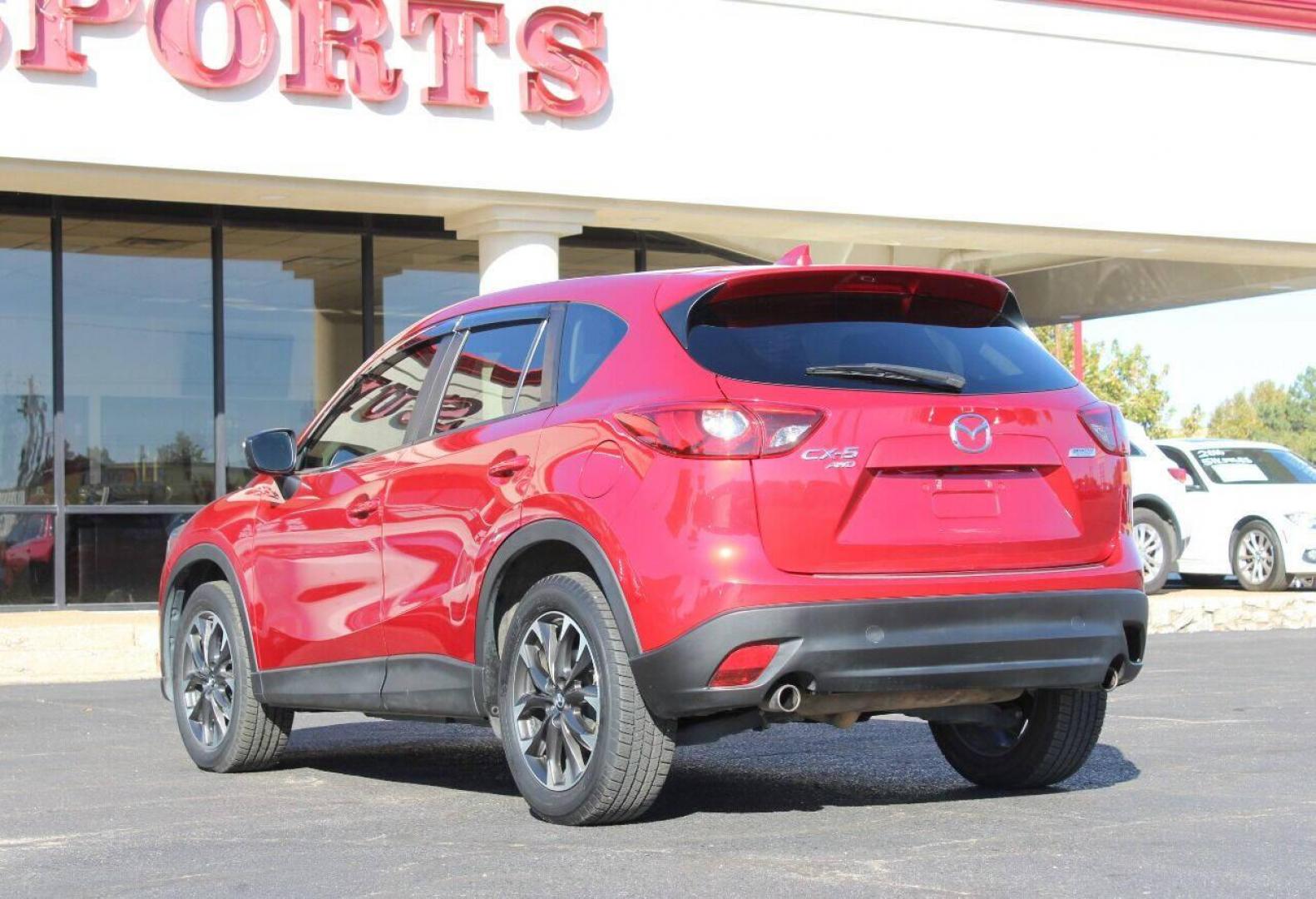 2016 Burgundy Mazda CX-5 Grand Touring AWD (JM3KE4DY9G0) with an 2.5L L4 DOHC 16V engine, 6-Speed Automatic transmission, located at 4301 NW 39th , Oklahoma City, OK, 73112, (405) 949-5600, 35.512135, -97.598671 - NO DRIVERS LICENSE - NO FULL COVERAGE INSURANCE - NO CREDIT CHECK. COME ON OVER TO SUPERSPORTS AND TAKE A LOOK AND TEST DRIVE. PLEASE GIVE US A CALL AT (405) 949-5600. NO LICENCIA DE MANEJAR - NO SEGURO DE COBERTURA TOTAL - NO VERIFICACION DE CREDITO. POR FAVOR VENGAN A SUPERSPORTS, ECH - Photo#5