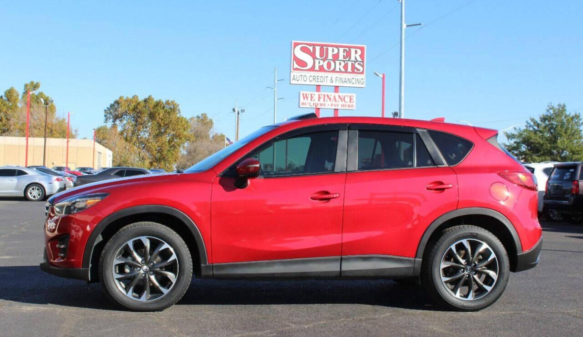 2016 Burgundy Mazda CX-5 Grand Touring AWD (JM3KE4DY9G0) with an 2.5L L4 DOHC 16V engine, 6-Speed Automatic transmission, located at 4301 NW 39th , Oklahoma City, OK, 73112, (405) 949-5600, 35.512135, -97.598671 - NO DRIVERS LICENSE - NO FULL COVERAGE INSURANCE - NO CREDIT CHECK. COME ON OVER TO SUPERSPORTS AND TAKE A LOOK AND TEST DRIVE. PLEASE GIVE US A CALL AT (405) 949-5600. NO LICENCIA DE MANEJAR - NO SEGURO DE COBERTURA TOTAL - NO VERIFICACION DE CREDITO. POR FAVOR VENGAN A SUPERSPORTS, ECH - Photo#6
