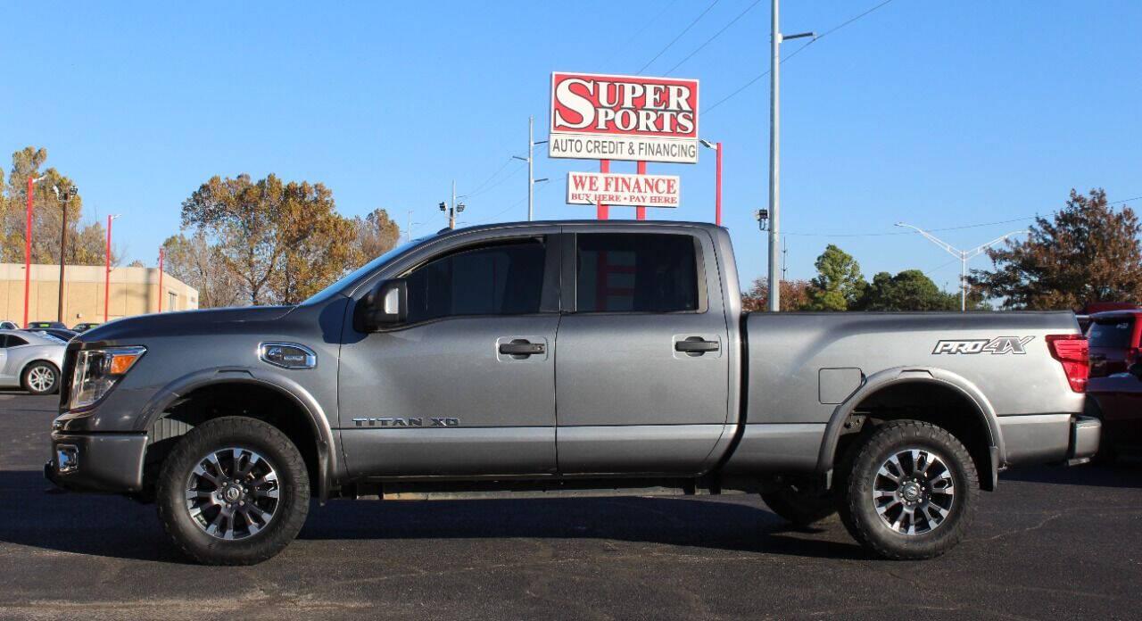 2017 Gray Nissan Titan XD SL 4WD Diesel (1N6BA1F45HN) with an 5.0L V8 Turbocharger 5.0L V8 engine, Automatic 6-Speed transmission, located at 4301 NW 39th , Oklahoma City, OK, 73112, (405) 949-5600, 35.512135, -97.598671 - Hablamos espanol. SPEND SMART --- BUY FROM SUPER SPORTS. ALL PRICES, DOWN PAYMENTS, PAYMENTS, AND FINANCE TERMS ARE NEGOTIABLE AT THE TIME OF APPROVAL. WE WILL WORK WITH YOU TO FIT YOUR BUDGET. WE WILL EVEN LOWER AND ADJUST THE NUMBERS TO HELP MAKE THE VE HICLE MORE AFFORDABLE FOR YOU.- Photo#6