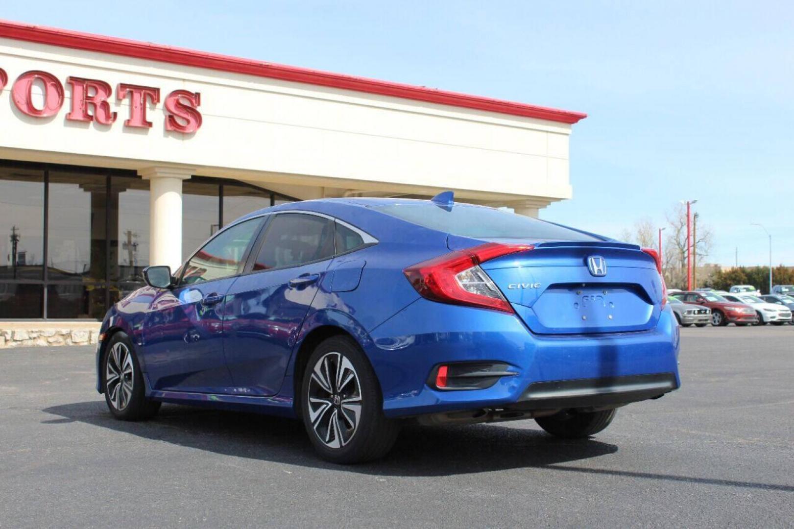 2016 Blue Honda Civic EX-T Sedan CVT (19XFC1F31GE) with an 1.5L L4 DOHC 16V TURBO engine, CVT transmission, located at 4301 NW 39th , Oklahoma City, OK, 73112, (405) 949-5600, 35.512135, -97.598671 - NO DRIVERS LICENSE - NO FULL COVERAGE INSURANCE - NO CREDIT CHECK. COME ON OVER TO SUPERSPORTS AND TAKE A LOOK AND TEST DRIVE PLEASE GIVE US A CALL AT (405) 949-5600. NO LICENCIA DE MANEJAR - NO SEGURO DE COBERTURA TOTAL- NO VERIFICACCION DE CREDITO. POR FAVOR VENGAN A SUPERSPORTS, ECHE - Photo#5