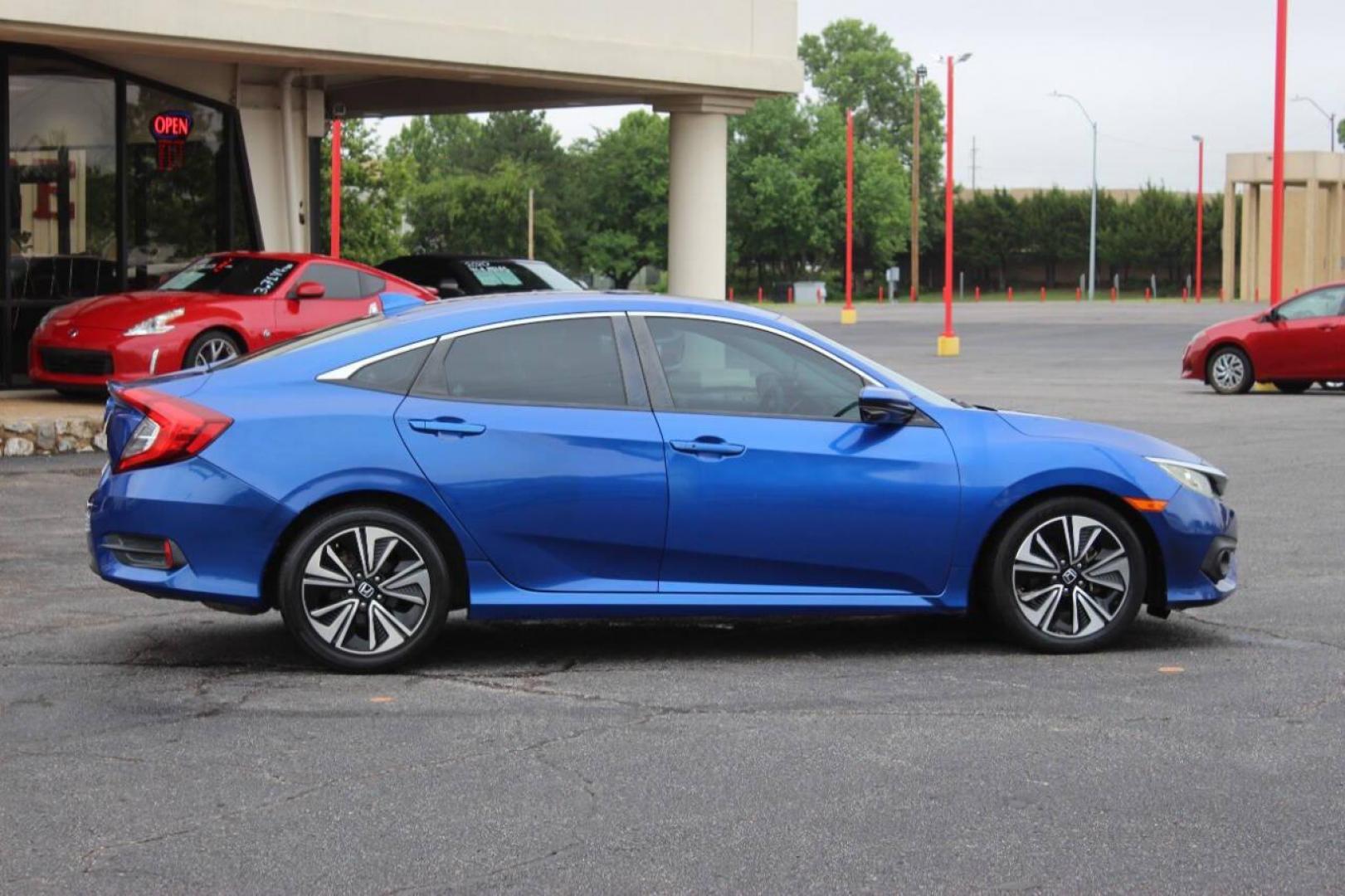 2016 Blue Honda Civic EX-T Sedan CVT (19XFC1F31GE) with an 1.5L L4 DOHC 16V TURBO engine, CVT transmission, located at 4301 NW 39th , Oklahoma City, OK, 73112, (405) 949-5600, 35.512135, -97.598671 - NO DRIVERS LICENCE NO-FULL COVERAGE INSURANCE-NO CREDIT CHECK. COME ON OVER TO SUPERSPORTS AND TAKE A LOOK AND TEST DRIVE. PLEASE GIVE US A CALL AT (405) 949-5600. NO LICENSIA DE MANEJAR- NO SEGURO DE COBERTURA TOTAL- NO VERIFICACCION DE CREDITO. POR FAVOR VENGAN A SUPERSPORTS, ECHE UN - Photo#3