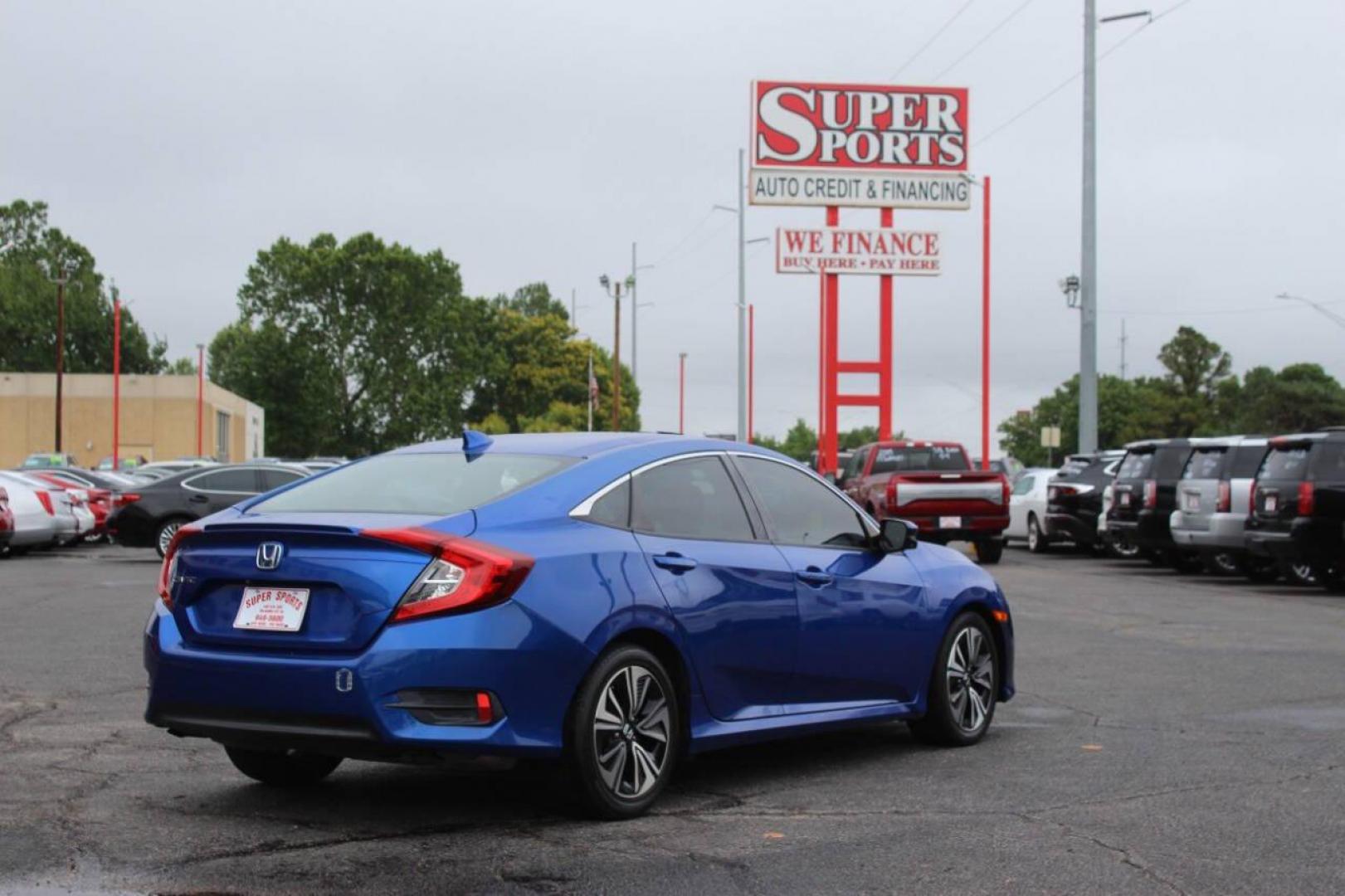 2016 Blue Honda Civic EX-T Sedan CVT (19XFC1F31GE) with an 1.5L L4 DOHC 16V TURBO engine, CVT transmission, located at 4301 NW 39th , Oklahoma City, OK, 73112, (405) 949-5600, 35.512135, -97.598671 - NO DRIVERS LICENCE NO-FULL COVERAGE INSURANCE-NO CREDIT CHECK. COME ON OVER TO SUPERSPORTS AND TAKE A LOOK AND TEST DRIVE. PLEASE GIVE US A CALL AT (405) 949-5600. NO LICENSIA DE MANEJAR- NO SEGURO DE COBERTURA TOTAL- NO VERIFICACCION DE CREDITO. POR FAVOR VENGAN A SUPERSPORTS, ECHE UN - Photo#4