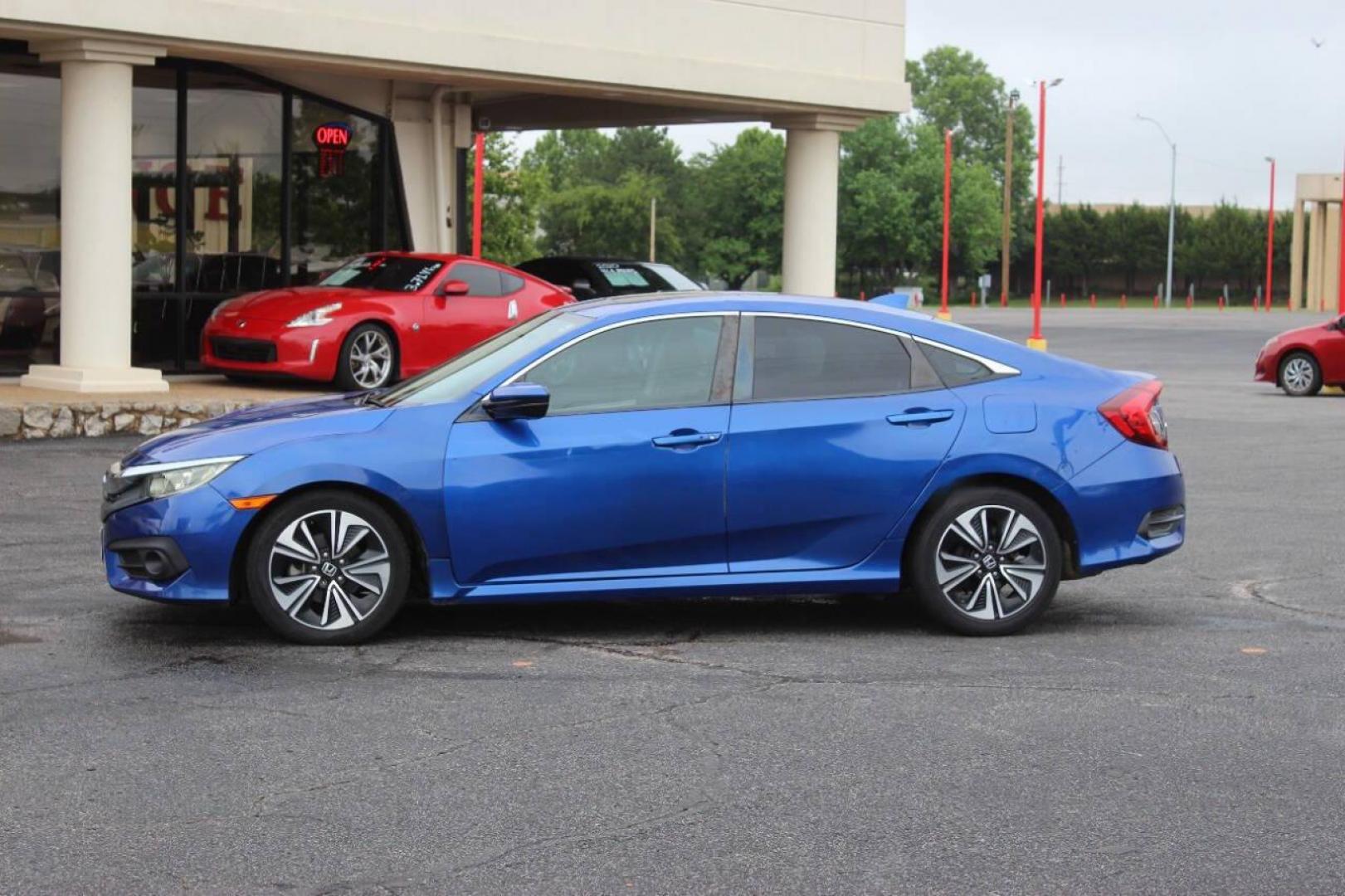 2016 Blue Honda Civic EX-T Sedan CVT (19XFC1F31GE) with an 1.5L L4 DOHC 16V TURBO engine, CVT transmission, located at 4301 NW 39th , Oklahoma City, OK, 73112, (405) 949-5600, 35.512135, -97.598671 - NO DRIVERS LICENCE NO-FULL COVERAGE INSURANCE-NO CREDIT CHECK. COME ON OVER TO SUPERSPORTS AND TAKE A LOOK AND TEST DRIVE. PLEASE GIVE US A CALL AT (405) 949-5600. NO LICENSIA DE MANEJAR- NO SEGURO DE COBERTURA TOTAL- NO VERIFICACCION DE CREDITO. POR FAVOR VENGAN A SUPERSPORTS, ECHE UN - Photo#6