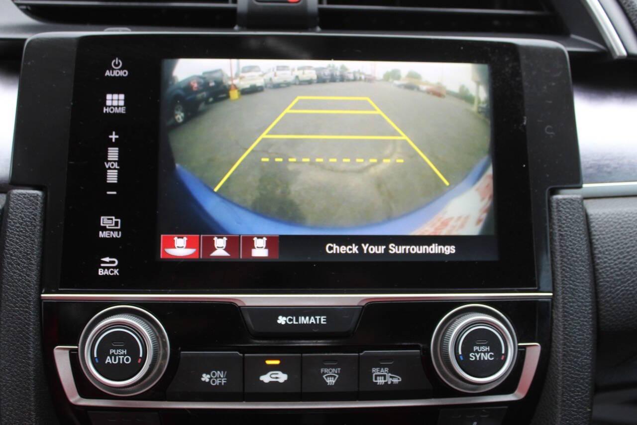 2016 Blue Honda Civic EX-T Sedan CVT (19XFC1F31GE) with an 1.5L L4 DOHC 16V TURBO engine, CVT transmission, located at 4301 NW 39th , Oklahoma City, OK, 73112, (405) 949-5600, 35.512135, -97.598671 - NO DRIVERS LICENCE -NO FULL COVERAGE INSURANCE - NO CREDIT CHECK. COME ON OVER TO SUPERSPORTS, TAKE A LOOK AND TEST DRIVE. PLEASE GIVE US A CALL AT (405) 949-5600. NO LICENCIA DE CONDUCIR - NO SEGURO DE COBERTURA TOTAL - NO VERIFICACION DE CREDITO. VISITENOS EN SUPERSPORTS, MIRE NUESTRO - Photo#17