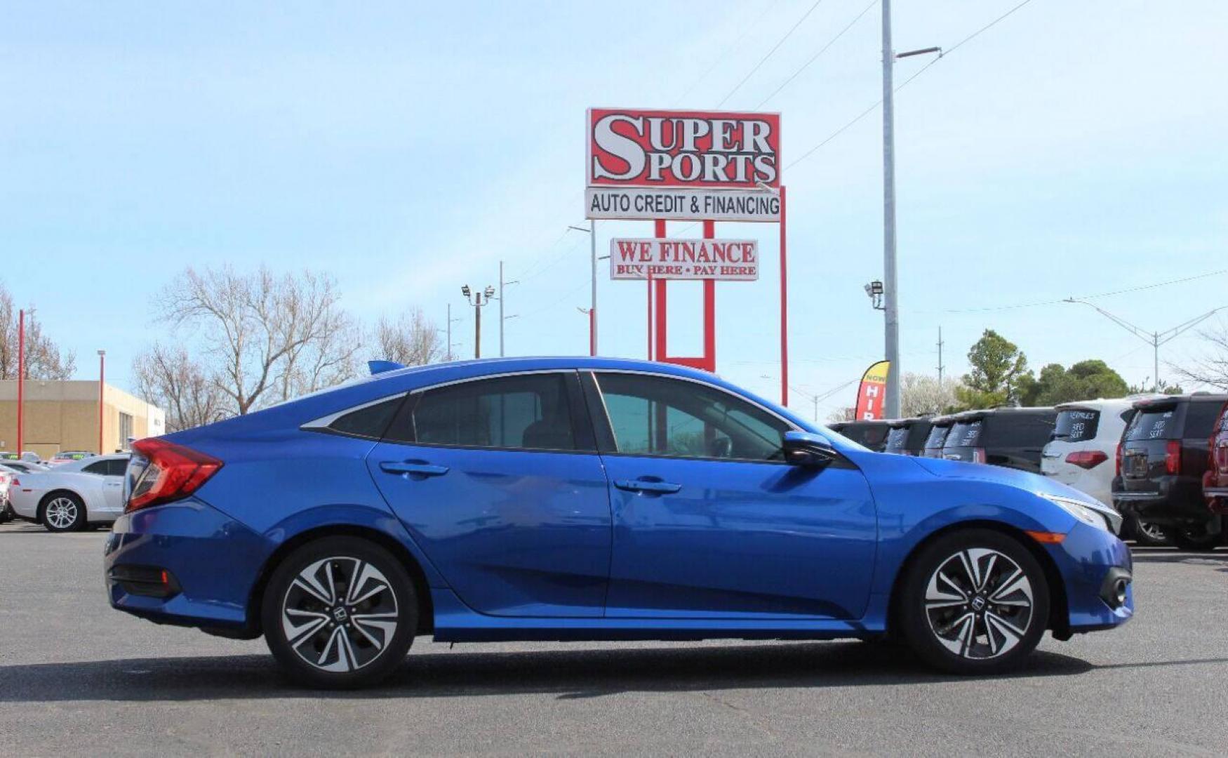 2016 Blue Honda Civic EX-T Sedan CVT (19XFC1F31GE) with an 1.5L L4 DOHC 16V TURBO engine, CVT transmission, located at 4301 NW 39th , Oklahoma City, OK, 73112, (405) 949-5600, 35.512135, -97.598671 - NO DRIVERS LICENSE - NO FULL COVERAGE INSURANCE - NO CREDIT CHECK. COME ON OVER TO SUPERSPORTS AND TAKE A LOOK AND TEST DRIVE PLEASE GIVE US A CALL AT (405) 949-5600. NO LICENCIA DE MANEJAR - NO SEGURO DE COBERTURA TOTAL- NO VERIFICACCION DE CREDITO. POR FAVOR VENGAN A SUPERSPORTS, ECHE - Photo#3