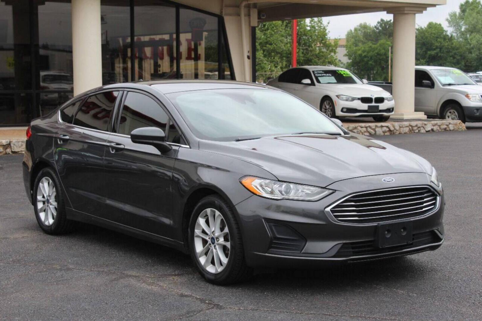 2019 Charcoal Ford Fusion SE (3FA6P0HD7KR) with an 1.5L L4 DOHC 16V engine, 6A transmission, located at 4301 NW 39th , Oklahoma City, OK, 73112, (405) 949-5600, 35.512135, -97.598671 - NO DRIVERS LICENCE NO-FULL COVERAGE INSURANCE-NO CREDIT CHECK. COME ON OVER TO SUPERSPORTS AND TAKE A LOOK AND TEST DRIVE PLEASE GIVE US A CALL AT (405) 949-5600. NO LICENSIA DE MANEJAR- NO SEGURO DE COBERTURA TOTAL- NO VERIFICACCION DE CREDITO. POR FAVOR VENGAN A SUPERSPORTS, - Photo#3