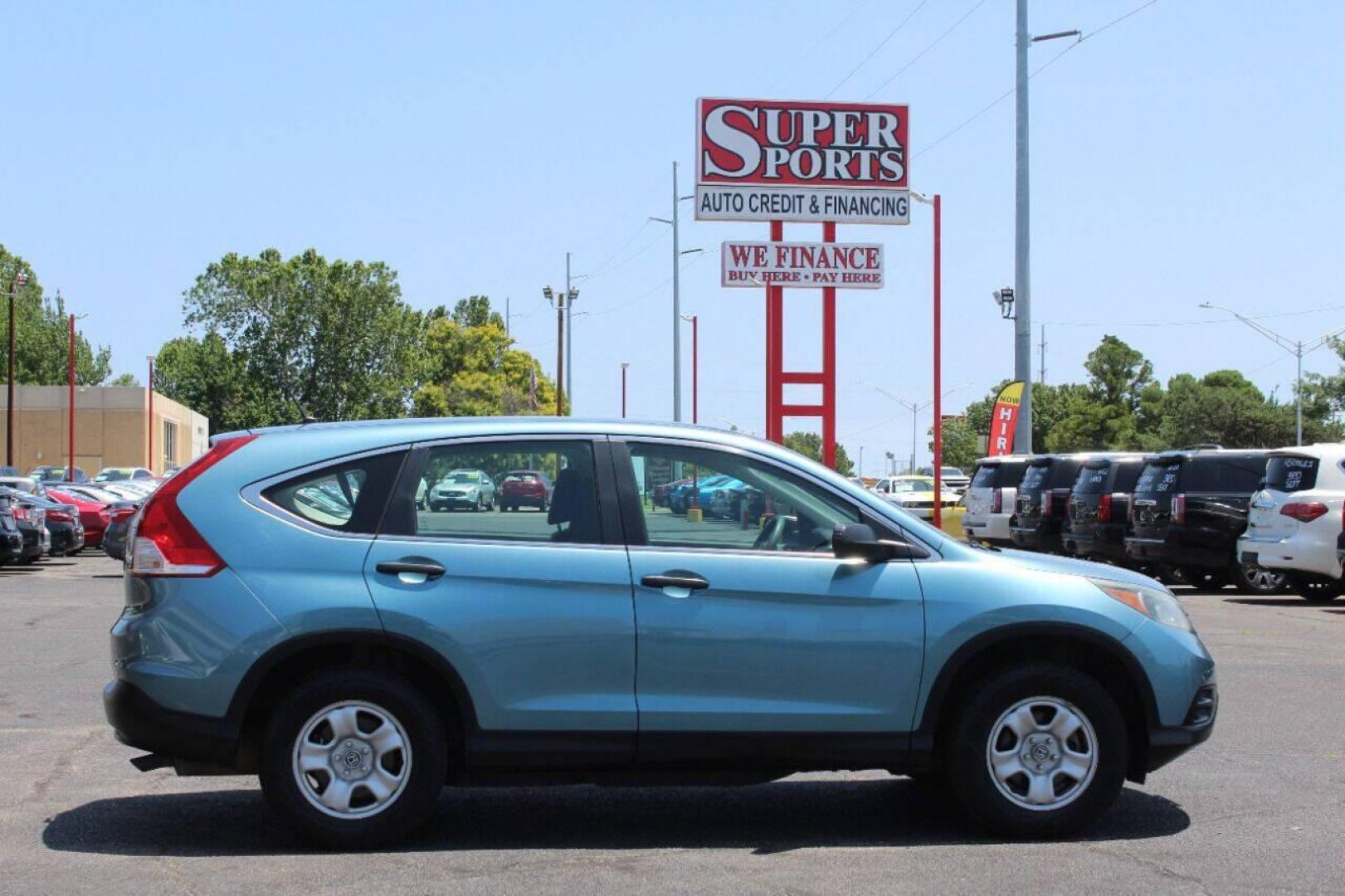 2014 Teal Honda CR-V LX 2WD 5-Speed AT (2HKRM3H33EH) with an 2.4L L4 DOHC 16V engine, 5-Speed Automatic transmission, located at 4301 NW 39th , Oklahoma City, OK, 73112, (405) 949-5600, 35.512135, -97.598671 - NO DRIVERS LICENCE -NO FULL COVERAGE INSURANCE - NO CREDIT CHECK. COME ON OVER TO SUPERSPORTS, TAKE A LOOK AND TEST DRIVE. PLEASE GIVE US A CALL AT (405) 949-5600. NO LICENCIA DE CONDUCIR - NO SEGURO DE COBERTURA TOTAL - NO VERIFICACION DE CREDITO. VISITENOS EN SUPERSPORTS, MIRE NUESTRO - Photo#4