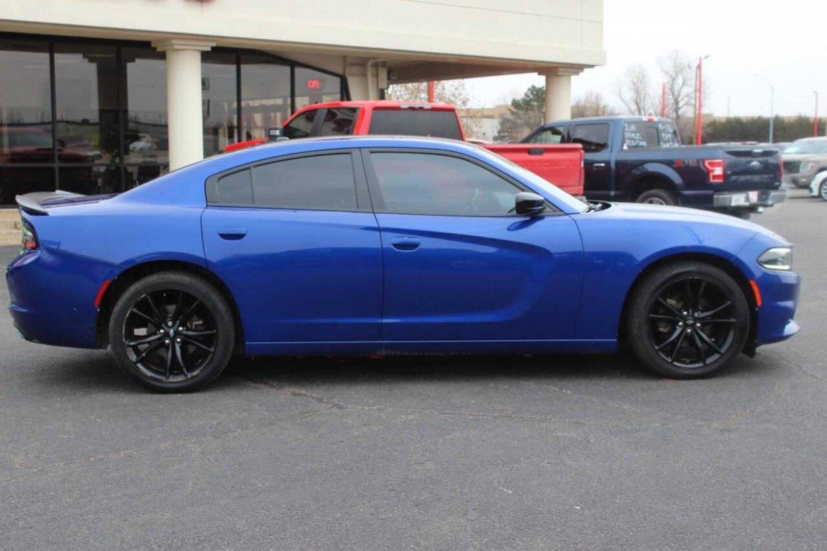 2018 Black Dodge Charger SE (2C3CDXBG9JH) with an 3.6L V6 DOHC 24V engine, 8A transmission, located at 4301 NW 39th , Oklahoma City, OK, 73112, (405) 949-5600, 35.512135, -97.598671 - NO DRIVERS LICENCE NO-FULL COVERAGE INSURANCE-NO CREDIT CHECK. COME ON OVER TO SUPERSPORTS AND TAKE A LOOK AND TEST DRIVE. PLEASE GIVE US A CALL AT (405) 949-5600. NO LICENSIA DE MANEJAR- NO SEGURO DE COBERTURA TOTAL- NO VERIFICACCION DE CREDITO. POR FAVOR VENGAN A SUPERSPORTS, ECHE UN - Photo#2