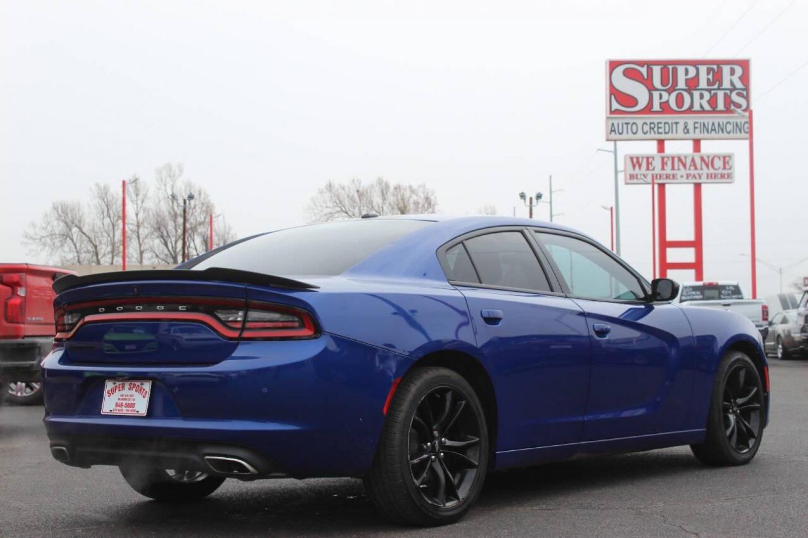 2018 Black Dodge Charger SE (2C3CDXBG9JH) with an 3.6L V6 DOHC 24V engine, 8A transmission, located at 4301 NW 39th , Oklahoma City, OK, 73112, (405) 949-5600, 35.512135, -97.598671 - NO DRIVERS LICENCE NO-FULL COVERAGE INSURANCE-NO CREDIT CHECK. COME ON OVER TO SUPERSPORTS AND TAKE A LOOK AND TEST DRIVE. PLEASE GIVE US A CALL AT (405) 949-5600. NO LICENSIA DE MANEJAR- NO SEGURO DE COBERTURA TOTAL- NO VERIFICACCION DE CREDITO. POR FAVOR VENGAN A SUPERSPORTS, ECHE UN - Photo#3