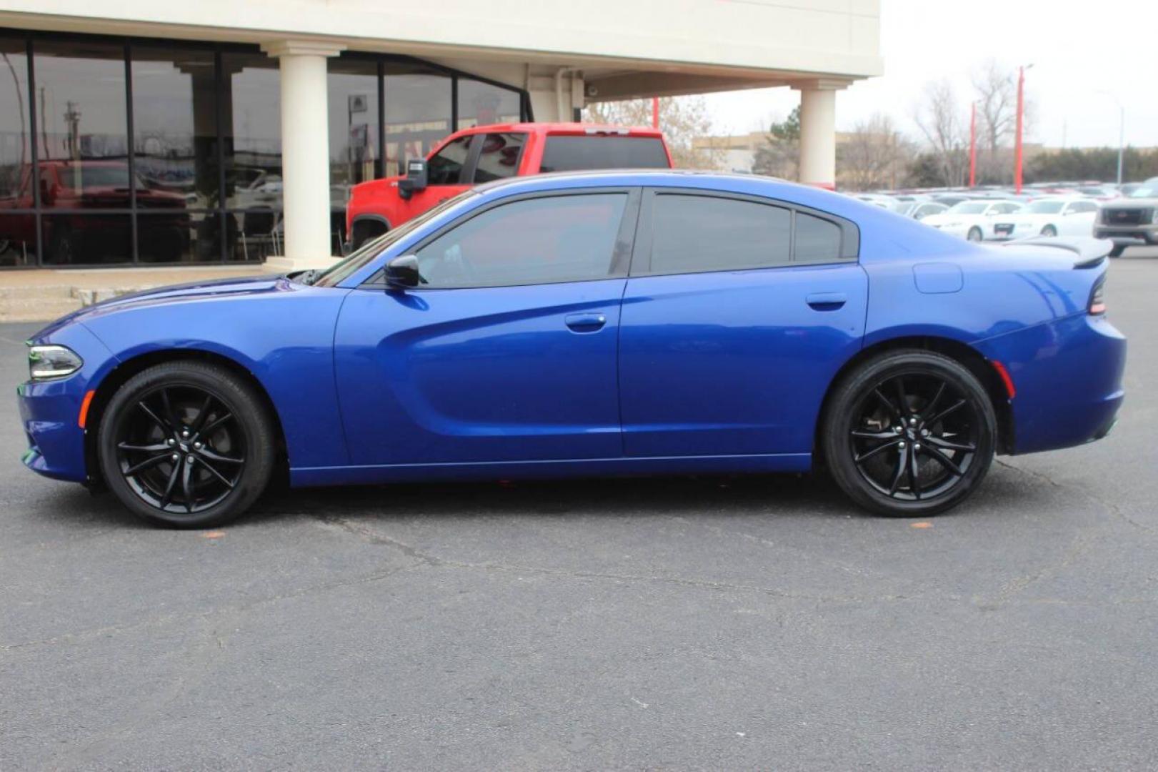 2018 Black Dodge Charger SE (2C3CDXBG9JH) with an 3.6L V6 DOHC 24V engine, 8A transmission, located at 4301 NW 39th , Oklahoma City, OK, 73112, (405) 949-5600, 35.512135, -97.598671 - NO DRIVERS LICENCE NO-FULL COVERAGE INSURANCE-NO CREDIT CHECK. COME ON OVER TO SUPERSPORTS AND TAKE A LOOK AND TEST DRIVE. PLEASE GIVE US A CALL AT (405) 949-5600. NO LICENSIA DE MANEJAR- NO SEGURO DE COBERTURA TOTAL- NO VERIFICACCION DE CREDITO. POR FAVOR VENGAN A SUPERSPORTS, ECHE UN - Photo#5
