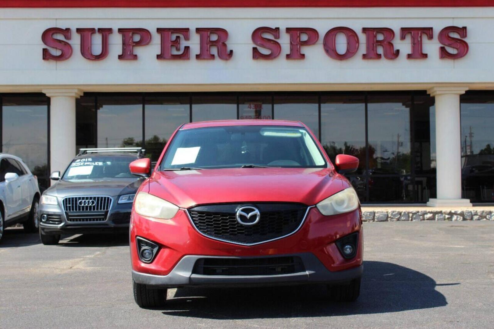 2015 Red Mazda CX-5 Touring (JM3KE2CYXF0) with an 2.5L L4 DOHC 16V engine, 6-Speed Automatic transmission, located at 4301 NW 39th , Oklahoma City, OK, 73112, (405) 949-5600, 35.512135, -97.598671 - NO DRIVERS LICENCE - NO FULL COVERAGE INSURANCE - NO CREDIT CHECK. COME ON OVER TO SUPERSPORTS AND TAKE A LOOK AND TEST DRIVE. PLEASE GIVE US A CALL AT (405) 949-5600. NO LICENCIA DE MANEJAR - NO SEGURO DE COBERTURA TOTAL - NO VERIFICACION DE CREDITO. POR FAVOR VENGAN A SUPERSPO - Photo#2