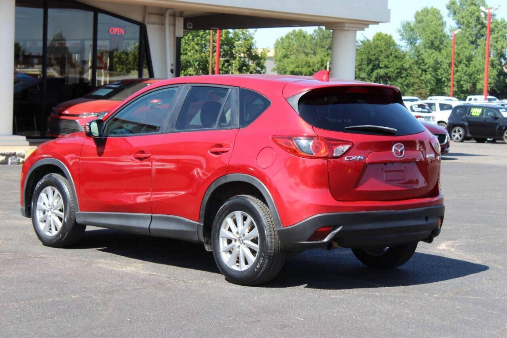 2015 Red Mazda CX-5 Touring (JM3KE2CYXF0) with an 2.5L L4 DOHC 16V engine, 6-Speed Automatic transmission, located at 4301 NW 39th , Oklahoma City, OK, 73112, (405) 949-5600, 35.512135, -97.598671 - NO DRIVERS LICENCE - NO FULL COVERAGE INSURANCE - NO CREDIT CHECK. COME ON OVER TO SUPERSPORTS AND TAKE A LOOK AND TEST DRIVE. PLEASE GIVE US A CALL AT (405) 949-5600. NO LICENCIA DE MANEJAR - NO SEGURO DE COBERTURA TOTAL - NO VERIFICACION DE CREDITO. POR FAVOR VENGAN A SUPERSPO - Photo#5