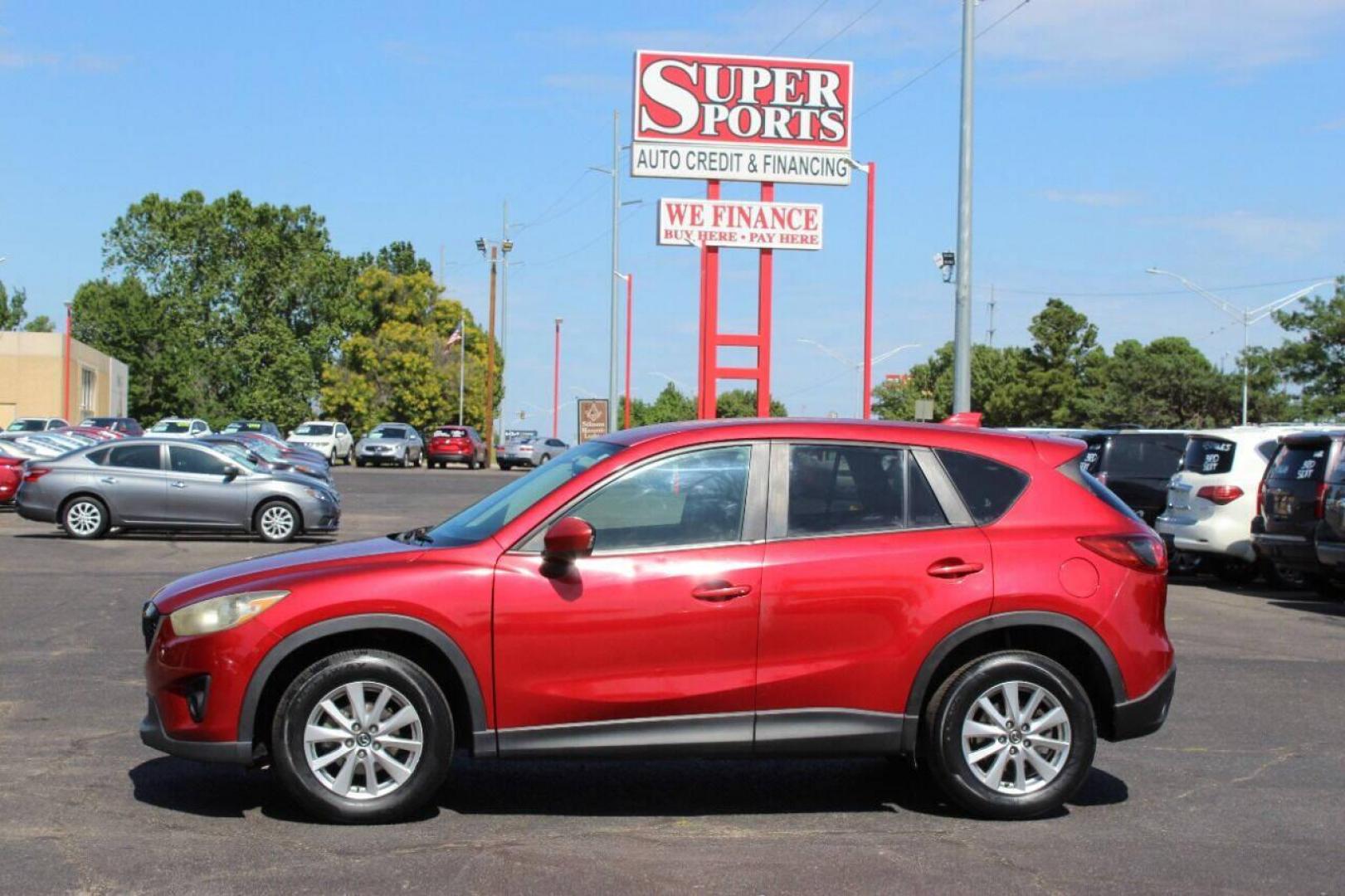2015 Red Mazda CX-5 Touring (JM3KE2CYXF0) with an 2.5L L4 DOHC 16V engine, 6-Speed Automatic transmission, located at 4301 NW 39th , Oklahoma City, OK, 73112, (405) 949-5600, 35.512135, -97.598671 - NO DRIVERS LICENCE - NO FULL COVERAGE INSURANCE - NO CREDIT CHECK. COME ON OVER TO SUPERSPORTS AND TAKE A LOOK AND TEST DRIVE. PLEASE GIVE US A CALL AT (405) 949-5600. NO LICENCIA DE MANEJAR - NO SEGURO DE COBERTURA TOTAL - NO VERIFICACION DE CREDITO. POR FAVOR VENGAN A SUPERSPO - Photo#6