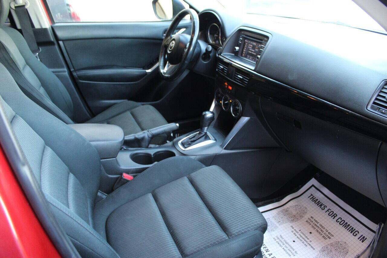 2015 Red Mazda CX-5 Touring (JM3KE2CYXF0) with an 2.5L L4 DOHC 16V engine, 6-Speed Automatic transmission, located at 4301 NW 39th , Oklahoma City, OK, 73112, (405) 949-5600, 35.512135, -97.598671 - NO DRIVERS LICENCE - NO FULL COVERAGE INSURANCE - NO CREDIT CHECK. COME ON OVER TO SUPERSPORTS AND TAKE A LOOK AND TEST DRIVE. PLEASE GIVE US A CALL AT (405) 949-5600. NO LICENCIA DE MANEJAR - NO SEGURO DE COBERTURA TOTAL - NO VERIFICACION DE CREDITO. POR FAVOR VENGAN A SUPERSPO - Photo#8