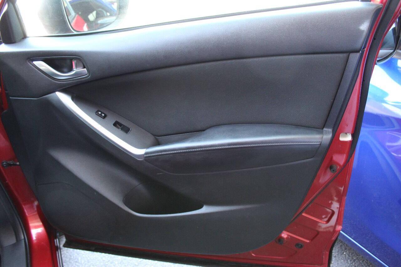 2015 Red Mazda CX-5 Touring (JM3KE2CYXF0) with an 2.5L L4 DOHC 16V engine, 6-Speed Automatic transmission, located at 4301 NW 39th , Oklahoma City, OK, 73112, (405) 949-5600, 35.512135, -97.598671 - NO DRIVERS LICENCE - NO FULL COVERAGE INSURANCE - NO CREDIT CHECK. COME ON OVER TO SUPERSPORTS AND TAKE A LOOK AND TEST DRIVE. PLEASE GIVE US A CALL AT (405) 949-5600. NO LICENCIA DE MANEJAR - NO SEGURO DE COBERTURA TOTAL - NO VERIFICACION DE CREDITO. POR FAVOR VENGAN A SUPERSPO - Photo#9