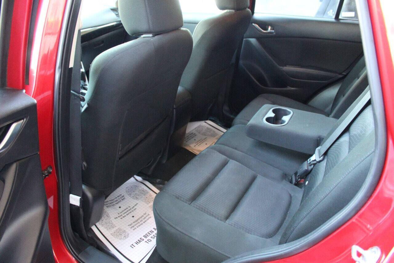 2015 Red Mazda CX-5 Touring (JM3KE2CYXF0) with an 2.5L L4 DOHC 16V engine, 6-Speed Automatic transmission, located at 4301 NW 39th , Oklahoma City, OK, 73112, (405) 949-5600, 35.512135, -97.598671 - NO DRIVERS LICENCE - NO FULL COVERAGE INSURANCE - NO CREDIT CHECK. COME ON OVER TO SUPERSPORTS AND TAKE A LOOK AND TEST DRIVE. PLEASE GIVE US A CALL AT (405) 949-5600. NO LICENCIA DE MANEJAR - NO SEGURO DE COBERTURA TOTAL - NO VERIFICACION DE CREDITO. POR FAVOR VENGAN A SUPERSPO - Photo#13