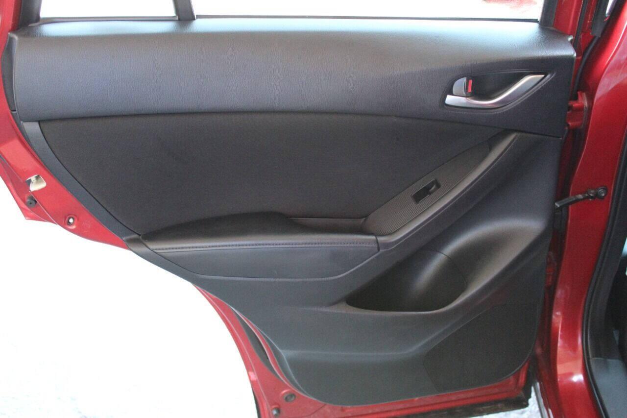 2015 Red Mazda CX-5 Touring (JM3KE2CYXF0) with an 2.5L L4 DOHC 16V engine, 6-Speed Automatic transmission, located at 4301 NW 39th , Oklahoma City, OK, 73112, (405) 949-5600, 35.512135, -97.598671 - NO DRIVERS LICENCE - NO FULL COVERAGE INSURANCE - NO CREDIT CHECK. COME ON OVER TO SUPERSPORTS AND TAKE A LOOK AND TEST DRIVE. PLEASE GIVE US A CALL AT (405) 949-5600. NO LICENCIA DE MANEJAR - NO SEGURO DE COBERTURA TOTAL - NO VERIFICACION DE CREDITO. POR FAVOR VENGAN A SUPERSPO - Photo#14
