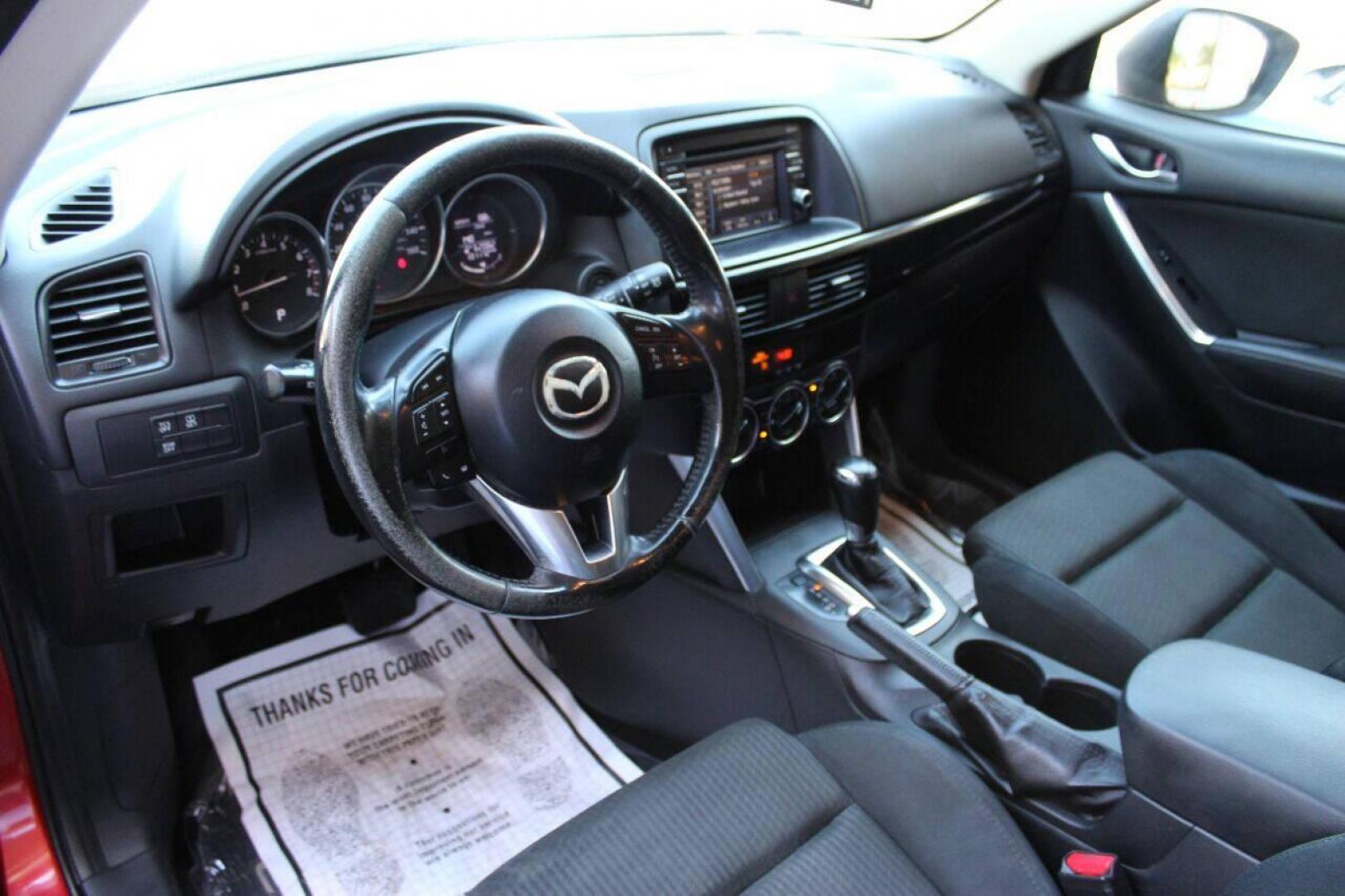 2015 Red Mazda CX-5 Touring (JM3KE2CYXF0) with an 2.5L L4 DOHC 16V engine, 6-Speed Automatic transmission, located at 4301 NW 39th , Oklahoma City, OK, 73112, (405) 949-5600, 35.512135, -97.598671 - NO DRIVERS LICENCE - NO FULL COVERAGE INSURANCE - NO CREDIT CHECK. COME ON OVER TO SUPERSPORTS AND TAKE A LOOK AND TEST DRIVE. PLEASE GIVE US A CALL AT (405) 949-5600. NO LICENCIA DE MANEJAR - NO SEGURO DE COBERTURA TOTAL - NO VERIFICACION DE CREDITO. POR FAVOR VENGAN A SUPERSPO - Photo#16