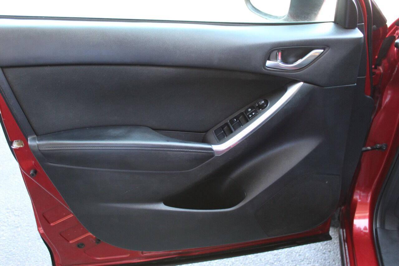 2015 Red Mazda CX-5 Touring (JM3KE2CYXF0) with an 2.5L L4 DOHC 16V engine, 6-Speed Automatic transmission, located at 4301 NW 39th , Oklahoma City, OK, 73112, (405) 949-5600, 35.512135, -97.598671 - NO DRIVERS LICENCE - NO FULL COVERAGE INSURANCE - NO CREDIT CHECK. COME ON OVER TO SUPERSPORTS AND TAKE A LOOK AND TEST DRIVE. PLEASE GIVE US A CALL AT (405) 949-5600. NO LICENCIA DE MANEJAR - NO SEGURO DE COBERTURA TOTAL - NO VERIFICACION DE CREDITO. POR FAVOR VENGAN A SUPERSPO - Photo#16