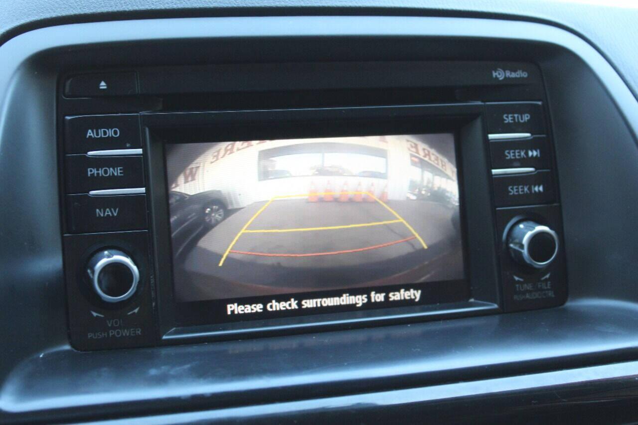 2015 Red Mazda CX-5 Touring (JM3KE2CYXF0) with an 2.5L L4 DOHC 16V engine, 6-Speed Automatic transmission, located at 4301 NW 39th , Oklahoma City, OK, 73112, (405) 949-5600, 35.512135, -97.598671 - NO DRIVERS LICENCE - NO FULL COVERAGE INSURANCE - NO CREDIT CHECK. COME ON OVER TO SUPERSPORTS AND TAKE A LOOK AND TEST DRIVE. PLEASE GIVE US A CALL AT (405) 949-5600. NO LICENCIA DE MANEJAR - NO SEGURO DE COBERTURA TOTAL - NO VERIFICACION DE CREDITO. POR FAVOR VENGAN A SUPERSPO - Photo#18