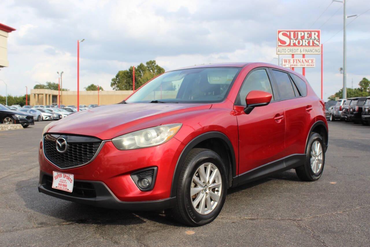 2015 Red Mazda CX-5 Touring (JM3KE2CYXF0) with an 2.5L L4 DOHC 16V engine, 6-Speed Automatic transmission, located at 4301 NW 39th , Oklahoma City, OK, 73112, (405) 949-5600, 35.512135, -97.598671 - NO DRIVERS LICENCE - NO FULL COVERAGE INSURANCE - NO CREDIT CHECK. COME ON OVER TO SUPERSPORTS AND TAKE A LOOK AND TEST DRIVE. PLEASE GIVE US A CALL AT (405) 949-5600. NO LICENCIA DE MANEJAR - NO SEGURO DE COBERTURA TOTAL - NO VERIFICACION DE CREDITO. POR FAVOR VENGAN A SUPERSPO - Photo#4