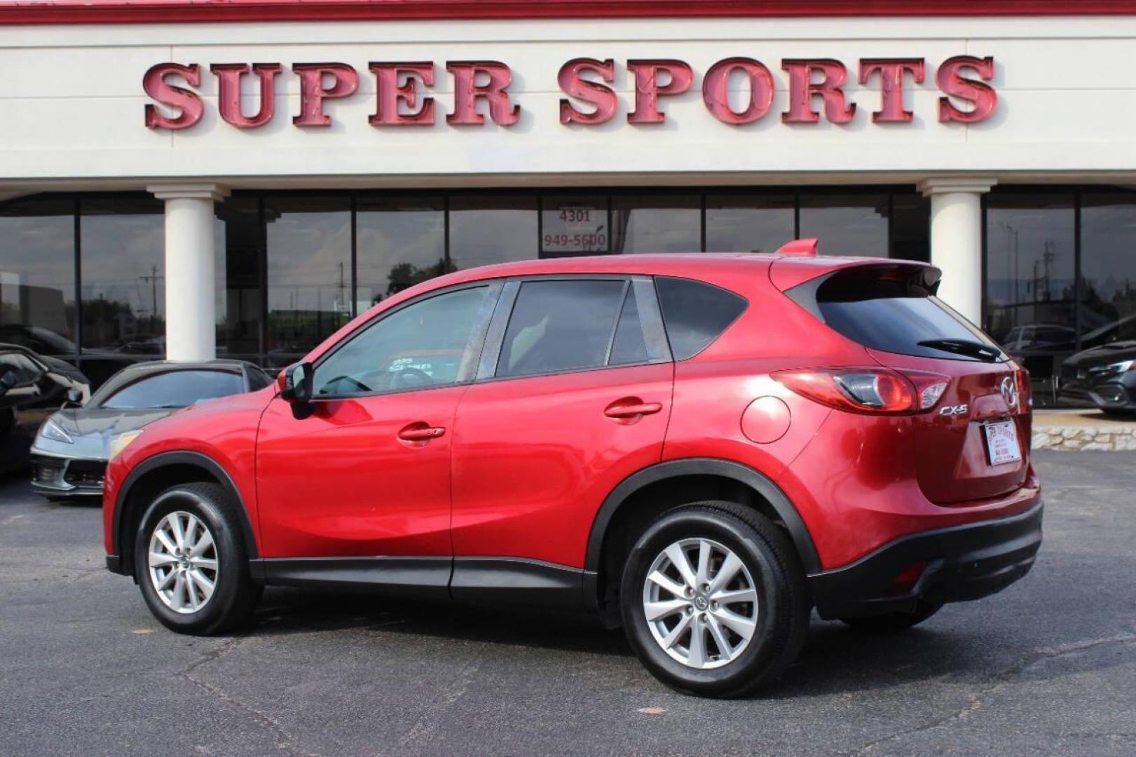 2015 Red Mazda CX-5 Touring (JM3KE2CYXF0) with an 2.5L L4 DOHC 16V engine, 6-Speed Automatic transmission, located at 4301 NW 39th , Oklahoma City, OK, 73112, (405) 949-5600, 35.512135, -97.598671 - NO DRIVERS LICENCE - NO FULL COVERAGE INSURANCE - NO CREDIT CHECK. COME ON OVER TO SUPERSPORTS AND TAKE A LOOK AND TEST DRIVE. PLEASE GIVE US A CALL AT (405) 949-5600. NO LICENCIA DE MANEJAR - NO SEGURO DE COBERTURA TOTAL - NO VERIFICACION DE CREDITO. POR FAVOR VENGAN A SUPERSPO - Photo#5