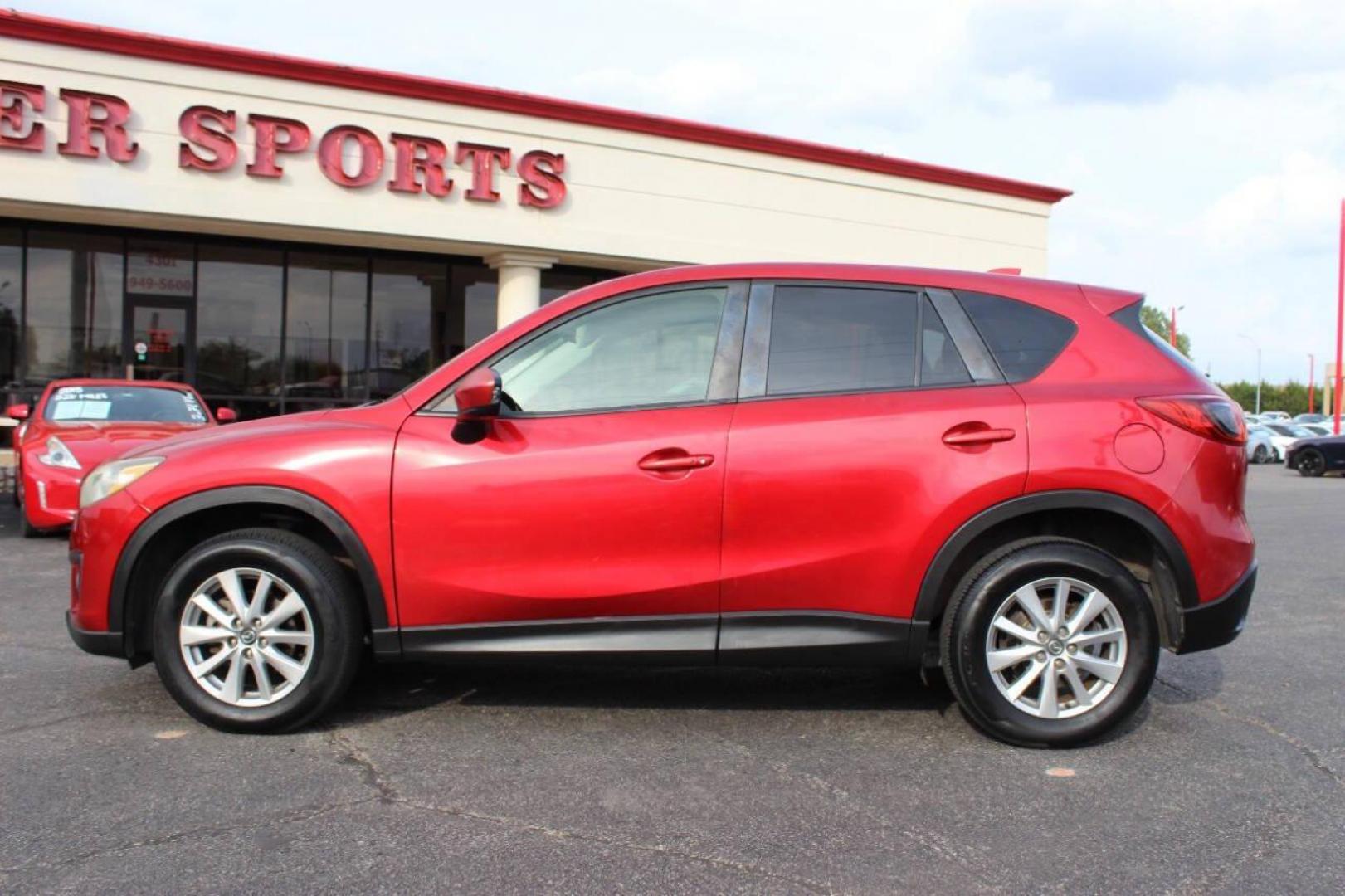 2015 Red Mazda CX-5 Touring (JM3KE2CYXF0) with an 2.5L L4 DOHC 16V engine, 6-Speed Automatic transmission, located at 4301 NW 39th , Oklahoma City, OK, 73112, (405) 949-5600, 35.512135, -97.598671 - NO DRIVERS LICENCE - NO FULL COVERAGE INSURANCE - NO CREDIT CHECK. COME ON OVER TO SUPERSPORTS AND TAKE A LOOK AND TEST DRIVE. PLEASE GIVE US A CALL AT (405) 949-5600. NO LICENCIA DE MANEJAR - NO SEGURO DE COBERTURA TOTAL - NO VERIFICACION DE CREDITO. POR FAVOR VENGAN A SUPERSPO - Photo#6