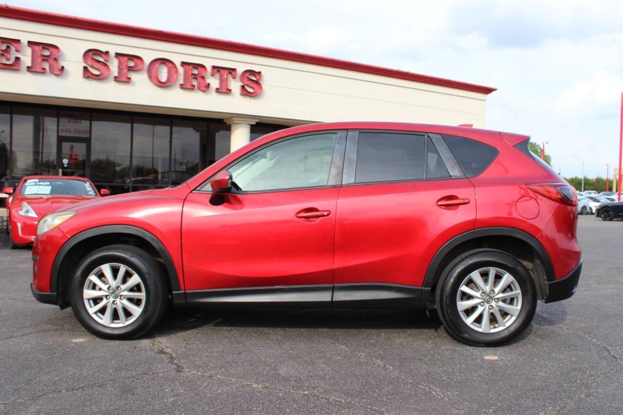 2015 Red Mazda CX-5 Touring (JM3KE2CYXF0) with an 2.5L L4 DOHC 16V engine, 6-Speed Automatic transmission, located at 4301 NW 39th , Oklahoma City, OK, 73112, (405) 949-5600, 35.512135, -97.598671 - NO DRIVERS LICENCE - NO FULL COVERAGE INSURANCE - NO CREDIT CHECK. COME ON OVER TO SUPERSPORTS AND TAKE A LOOK AND TEST DRIVE. PLEASE GIVE US A CALL AT (405) 949-5600. NO LICENCIA DE MANEJAR - NO SEGURO DE COBERTURA TOTAL - NO VERIFICACION DE CREDITO. POR FAVOR VENGAN A SUPERSPO - Photo#6
