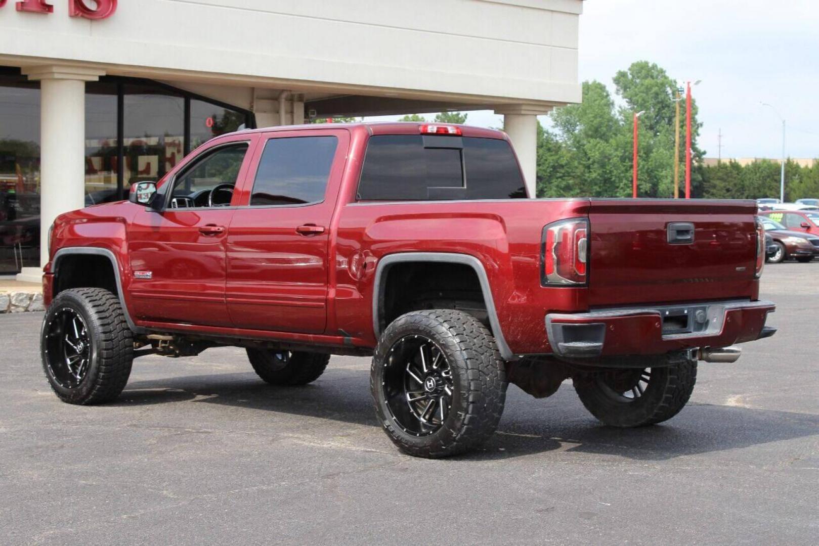 2017 Maroon GMC Sierra 1500 SLT Crew Cab Long Box 4WD (3GTU2NEC4HG) with an 5.3L V8 5.3L V8 engine, Automatic 6-Speed transmission, located at 4301 NW 39th , Oklahoma City, OK, 73112, (405) 949-5600, 35.512135, -97.598671 - NO DRIVERS LICENCE NO-FULL COVERAGE INSURANCE-NO CREDIT CHECK. COME ON OVER TO SUPERSPORTS AND TAKE A LOOK AND TEST DRIVE. PLEASE GIVE US A CALL AT (405) 949-5600. NO LICENSIA DE MANEJAR- NO SEGURO DE COBERTURA TOTAL- NO VERIFICACCION DE CREDITO. POR FAVOR VENGAN A SUPERSPORTS, ECHE UN - Photo#4