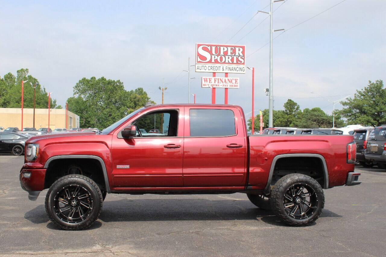 2017 Maroon GMC Sierra 1500 SLT Crew Cab Long Box 4WD (3GTU2NEC4HG) with an 5.3L V8 5.3L V8 engine, Automatic 6-Speed transmission, located at 4301 NW 39th , Oklahoma City, OK, 73112, (405) 949-5600, 35.512135, -97.598671 - NO DRIVERS LICENCE NO-FULL COVERAGE INSURANCE-NO CREDIT CHECK. COME ON OVER TO SUPERSPORTS AND TAKE A LOOK AND TEST DRIVE. PLEASE GIVE US A CALL AT (405) 949-5600. NO LICENSIA DE MANEJAR- NO SEGURO DE COBERTURA TOTAL- NO VERIFICACCION DE CREDITO. POR FAVOR VENGAN A SUPERSPORTS, ECHE UN - Photo#5