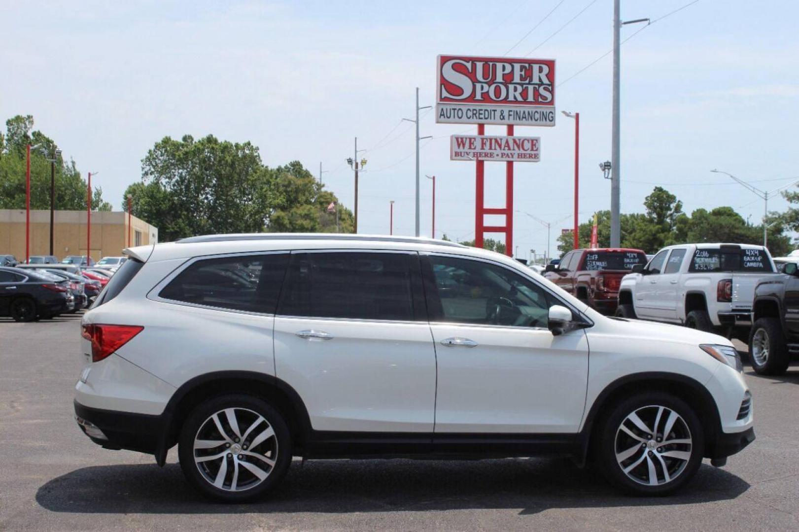 2017 White Honda Pilot Touring 2WD (5FNYF5H96HB) with an 3.5L V6 SOHC 24V engine, 9A transmission, located at 4301 NW 39th , Oklahoma City, OK, 73112, (405) 949-5600, 35.512135, -97.598671 - NO DRIVERS LICENCE NO-FULL COVERAGE INSURANCE-NO CREDIT CHECK. COME ON OVER TO SUPERSPORTS AND TAKE A LOOK AND TEST DRIVE PLEASE GIVE US A CALL AT (405) 949-5600. NO LICENSIA DE MANEJAR- NO SEGURO DE COBERTURA TOTAL- NO VERIFICACCION DE CREDITO. POR FAVOR VENGAN A SUPERSPORTS, ECHE UN VI - Photo#3