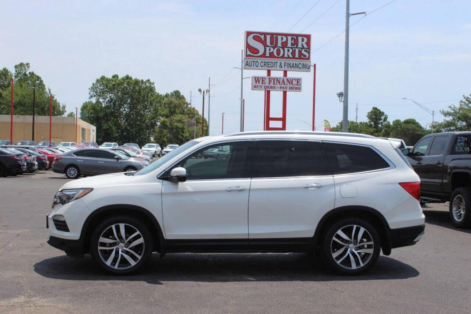 2017 White Honda Pilot Touring 2WD (5FNYF5H96HB) with an 3.5L V6 SOHC 24V engine, 9A transmission, located at 4301 NW 39th , Oklahoma City, OK, 73112, (405) 949-5600, 35.512135, -97.598671 - NO DRIVERS LICENCE NO-FULL COVERAGE INSURANCE-NO CREDIT CHECK. COME ON OVER TO SUPERSPORTS AND TAKE A LOOK AND TEST DRIVE PLEASE GIVE US A CALL AT (405) 949-5600. NO LICENSIA DE MANEJAR- NO SEGURO DE COBERTURA TOTAL- NO VERIFICACCION DE CREDITO. POR FAVOR VENGAN A SUPERSPORTS, ECHE UN VI - Photo#6