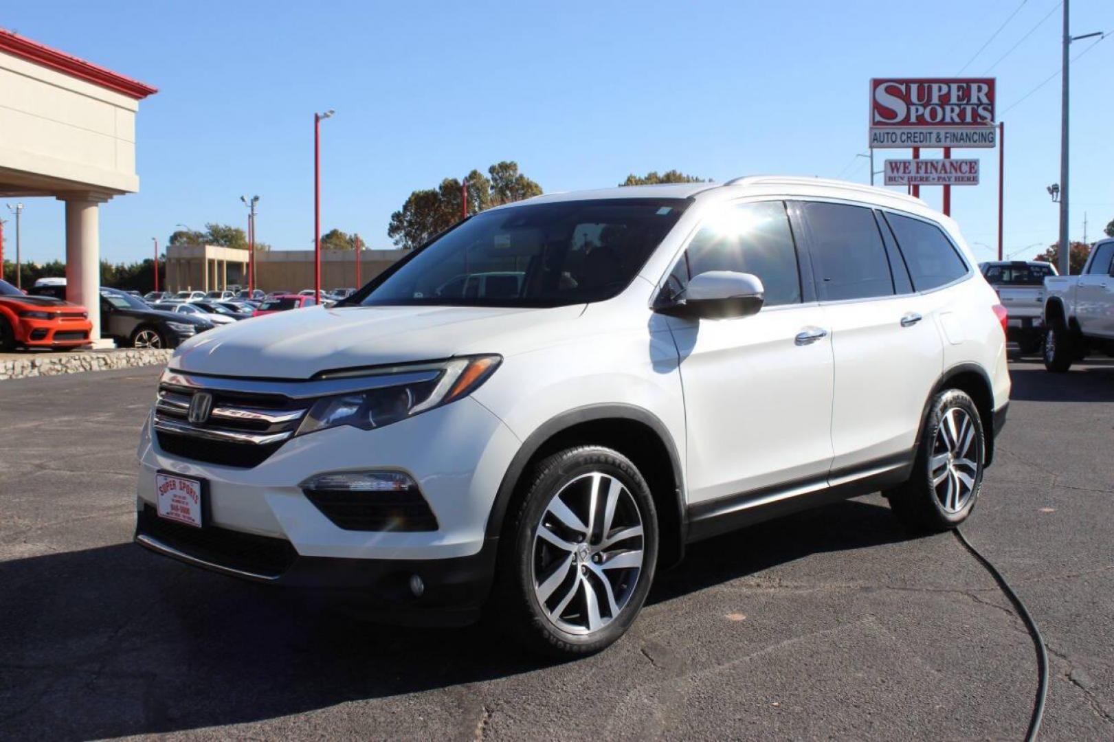 2017 White Honda Pilot Touring 2WD (5FNYF5H96HB) with an 3.5L V6 SOHC 24V engine, 9A transmission, located at 4301 NW 39th , Oklahoma City, OK, 73112, (405) 949-5600, 35.512135, -97.598671 - NO DRIVERS LICENCE NO-FULL COVERAGE INSURANCE-NO CREDIT CHECK. COME ON OVER TO SUPERSPORTS AND TAKE A LOOK AND TEST DRIVE PLEASE GIVE US A CALL AT (405) 949-5600. NO LICENSIA DE MANEJAR- NO SEGURO DE COBERTURA TOTAL- NO VERIFICACCION DE CREDITO. POR FAVOR VENGAN A SUPERSPORTS, ECHE UN VI - Photo#6