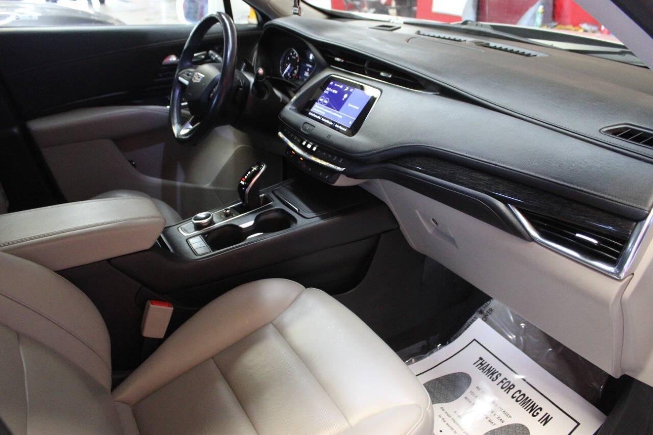 2021 White Cadillac XT4 Premium Luxury AWD (1GYFZDR46MF) with an 2.0L I4 Turbocharger 2.0L I4 engine, Automatic 9-Speed transmission, located at 4301 NW 39th , Oklahoma City, OK, 73112, (405) 949-5600, 35.512135, -97.598671 - NO DRIVERS LICENCE NO-FULL COVERAGE INSURANCE-NO CREDIT CHECK. COME ON OVER TO SUPERSPORTS AND TAKE A LOOK AND TEST DRIVE. PLEASE GIVE US A CALL AT (405) 949-5600. NO LICENSIA DE MANEJAR- NO SEGURO DE COBERTURA TOTAL- NO VERIFICACCION DE CREDITO. POR FAVOR VENGAN A SUPERSPORTS, ECHE UN - Photo#8