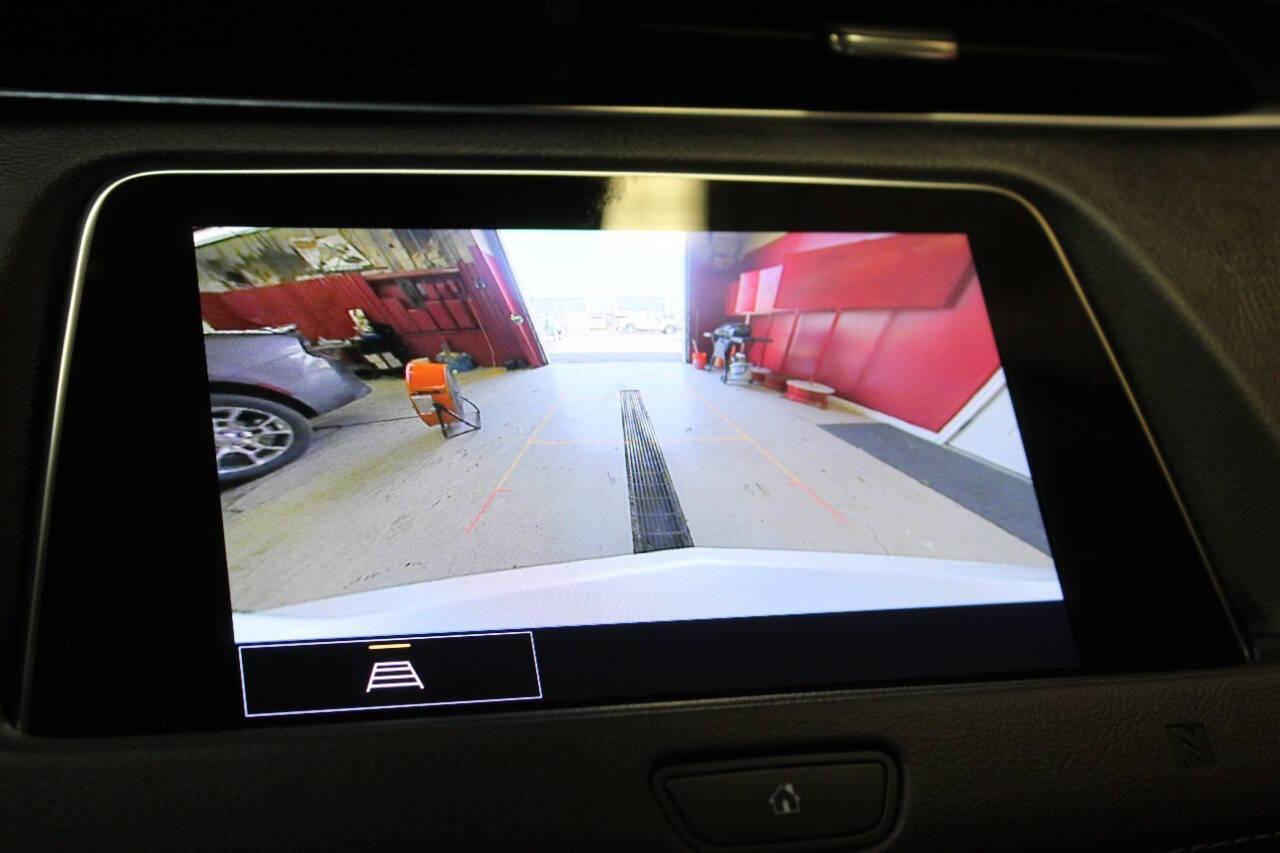 2021 White Cadillac XT4 Premium Luxury AWD (1GYFZDR46MF) with an 2.0L I4 Turbocharger 2.0L I4 engine, Automatic 9-Speed transmission, located at 4301 NW 39th , Oklahoma City, OK, 73112, (405) 949-5600, 35.512135, -97.598671 - NO DRIVERS LICENCE NO-FULL COVERAGE INSURANCE-NO CREDIT CHECK. COME ON OVER TO SUPERSPORTS AND TAKE A LOOK AND TEST DRIVE. PLEASE GIVE US A CALL AT (405) 949-5600. NO LICENSIA DE MANEJAR- NO SEGURO DE COBERTURA TOTAL- NO VERIFICACCION DE CREDITO. POR FAVOR VENGAN A SUPERSPORTS, ECHE UN - Photo#18