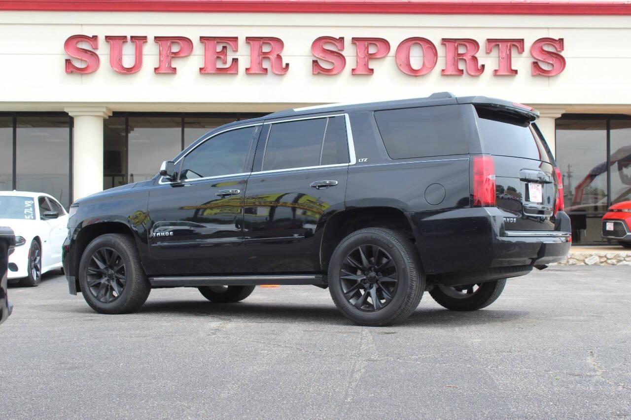 2015 Black Chevrolet Tahoe LTZ 4WD (1GNSKCKC9FR) with an 5.3L V8 5.3L V8 engine, Automatic 6-Speed transmission, located at 4301 NW 39th , Oklahoma City, OK, 73112, (405) 949-5600, 35.512135, -97.598671 - NO DRIVERS LICENCE NO-FULL COVERAGE INSURANCE-NO CREDIT CHECK. COME ON OVER TO SUPERSPORTS AND TAKE A LOOK AND TEST DRIVE. PLEASE GIVE US A CALL AT (405) 949-5600. NO LICENSIA DE MANEJAR- NO SEGURO DE COBERTURA TOTAL- NO VERIFICACCION DE CREDITO. POR FAVOR VENGAN A SUPERSPORTS, ECHE UN - Photo#4