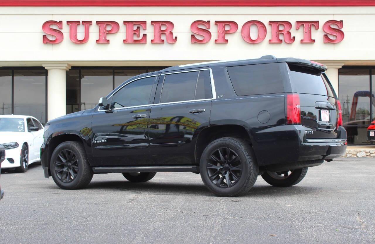 2015 Black Chevrolet Tahoe LTZ 4WD (1GNSKCKC9FR) with an 5.3L V8 5.3L V8 engine, Automatic 6-Speed transmission, located at 4301 NW 39th , Oklahoma City, OK, 73112, (405) 949-5600, 35.512135, -97.598671 - NO DRIVERS LICENCE NO-FULL COVERAGE INSURANCE-NO CREDIT CHECK. COME ON OVER TO SUPERSPORTS AND TAKE A LOOK AND TEST DRIVE. PLEASE GIVE US A CALL AT (405) 949-5600. NO LICENSIA DE MANEJAR- NO SEGURO DE COBERTURA TOTAL- NO VERIFICACCION DE CREDITO. POR FAVOR VENGAN A SUPERSPORTS, ECHE UN - Photo#5