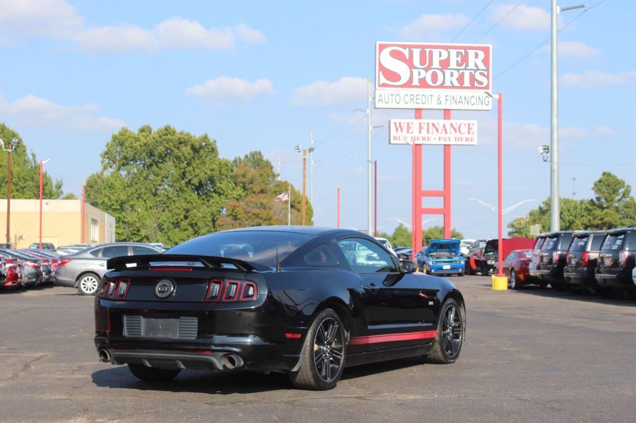 2013 Black Ford Mustang GT Coupe (1ZVBP8CF1D5) with an 5.0L V8 5.0L V8 engine, Manual 6-Speed transmission, located at 4301 NW 39th , Oklahoma City, OK, 73112, (405) 949-5600, 35.512135, -97.598671 - NO DRIVERS LICENCE NO-FULL COVERAGE INSURANCE-NO CREDIT CHECK. COME ON OVER TO SUPERSPORTS AND TAKE A LOOK AND TEST DRIVE. PLEASE GIVE US A CALL AT (405) 949-5600. NO LICENSIA DE MANEJAR- NO SEGURO DE COBERTURA TOTAL- NO VERIFICACCION DE CREDITO. POR FAVOR VENGAN A SUPERSPORTS, ECHE UN - Photo#3