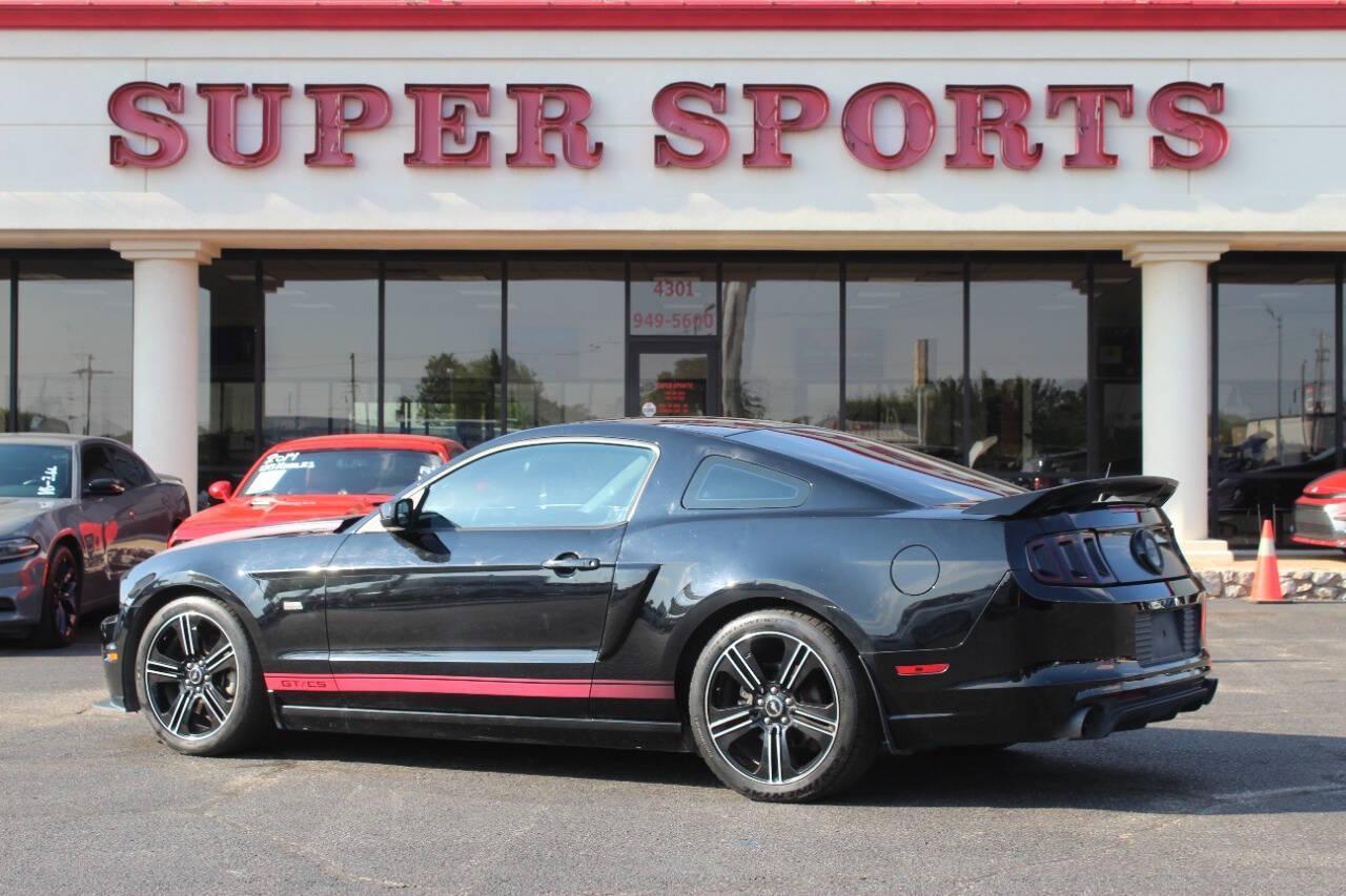 2013 Black Ford Mustang GT Coupe (1ZVBP8CF1D5) with an 5.0L V8 5.0L V8 engine, Manual 6-Speed transmission, located at 4301 NW 39th , Oklahoma City, OK, 73112, (405) 949-5600, 35.512135, -97.598671 - NO DRIVERS LICENCE NO-FULL COVERAGE INSURANCE-NO CREDIT CHECK. COME ON OVER TO SUPERSPORTS AND TAKE A LOOK AND TEST DRIVE. PLEASE GIVE US A CALL AT (405) 949-5600. NO LICENSIA DE MANEJAR- NO SEGURO DE COBERTURA TOTAL- NO VERIFICACCION DE CREDITO. POR FAVOR VENGAN A SUPERSPORTS, ECHE UN - Photo#4