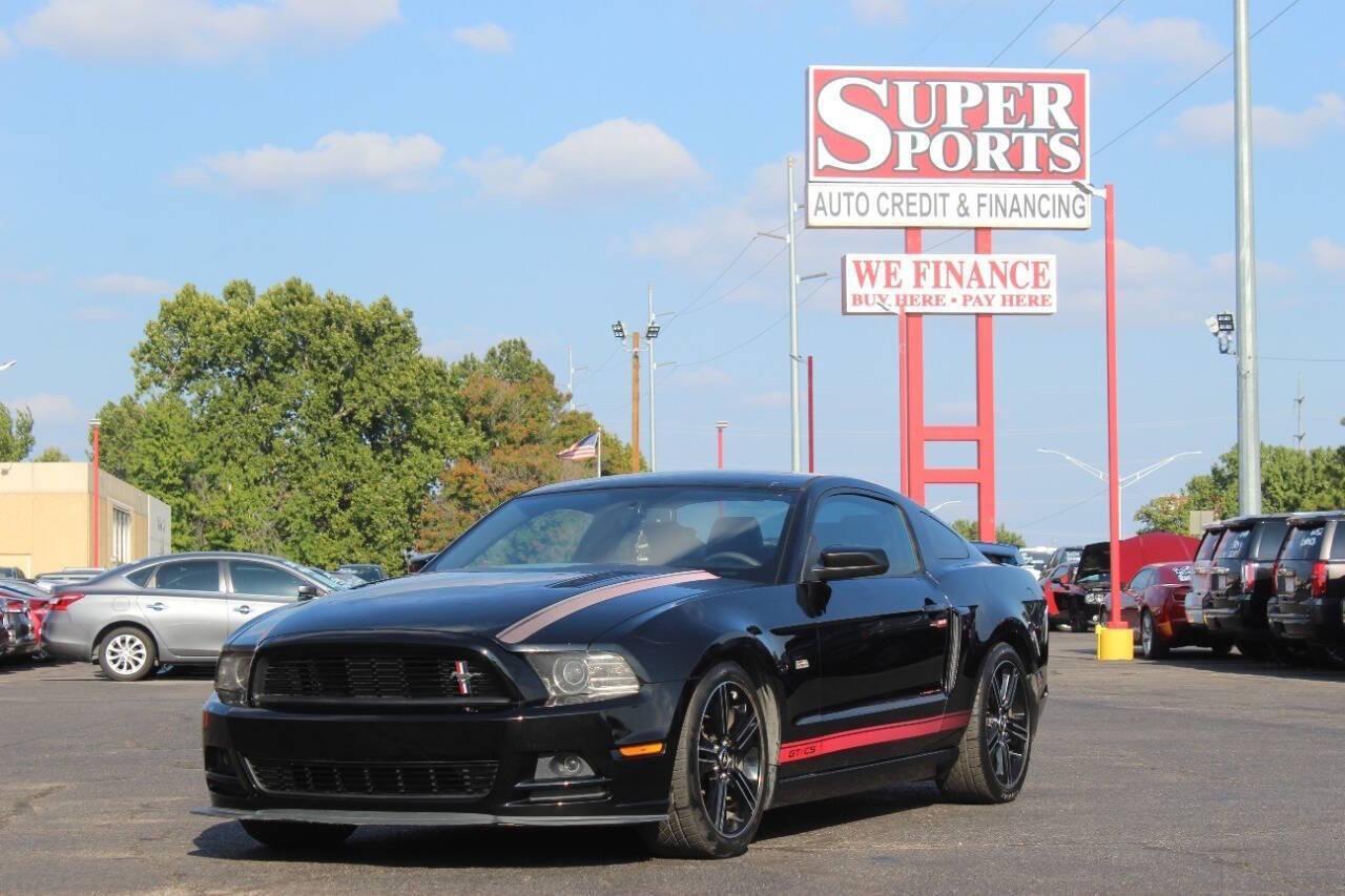 2013 Black Ford Mustang GT Coupe (1ZVBP8CF1D5) with an 5.0L V8 5.0L V8 engine, Manual 6-Speed transmission, located at 4301 NW 39th , Oklahoma City, OK, 73112, (405) 949-5600, 35.512135, -97.598671 - NO DRIVERS LICENCE NO-FULL COVERAGE INSURANCE-NO CREDIT CHECK. COME ON OVER TO SUPERSPORTS AND TAKE A LOOK AND TEST DRIVE. PLEASE GIVE US A CALL AT (405) 949-5600. NO LICENSIA DE MANEJAR- NO SEGURO DE COBERTURA TOTAL- NO VERIFICACCION DE CREDITO. POR FAVOR VENGAN A SUPERSPORTS, ECHE UN - Photo#6