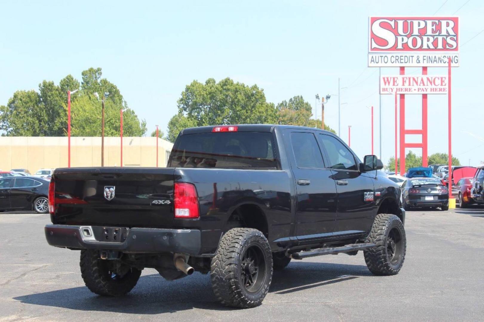 2017 Black RAM 2500 Tradesman Crew Cab SWB 4WD (3C6UR5CJ0HG) with an 6.4L V8 engine, 6A transmission, located at 4301 NW 39th , Oklahoma City, OK, 73112, (405) 949-5600, 35.512135, -97.598671 - NO DRIVERS LICENCE NO-FULL COVERAGE INSURANCE-NO CREDIT CHECK. COME ON OVER TO SUPERSPORTS AND TAKE A LOOK AND TEST DRIVE. PLEASE GIVE US A CALL AT (405) 949-5600. NO LICENSIA DE MANEJAR- NO SEGURO DE COBERTURA TOTAL- NO VERIFICACCION DE CREDITO. POR FAVOR VENGAN A SUPERSPORTS, ECHE UN - Photo#4