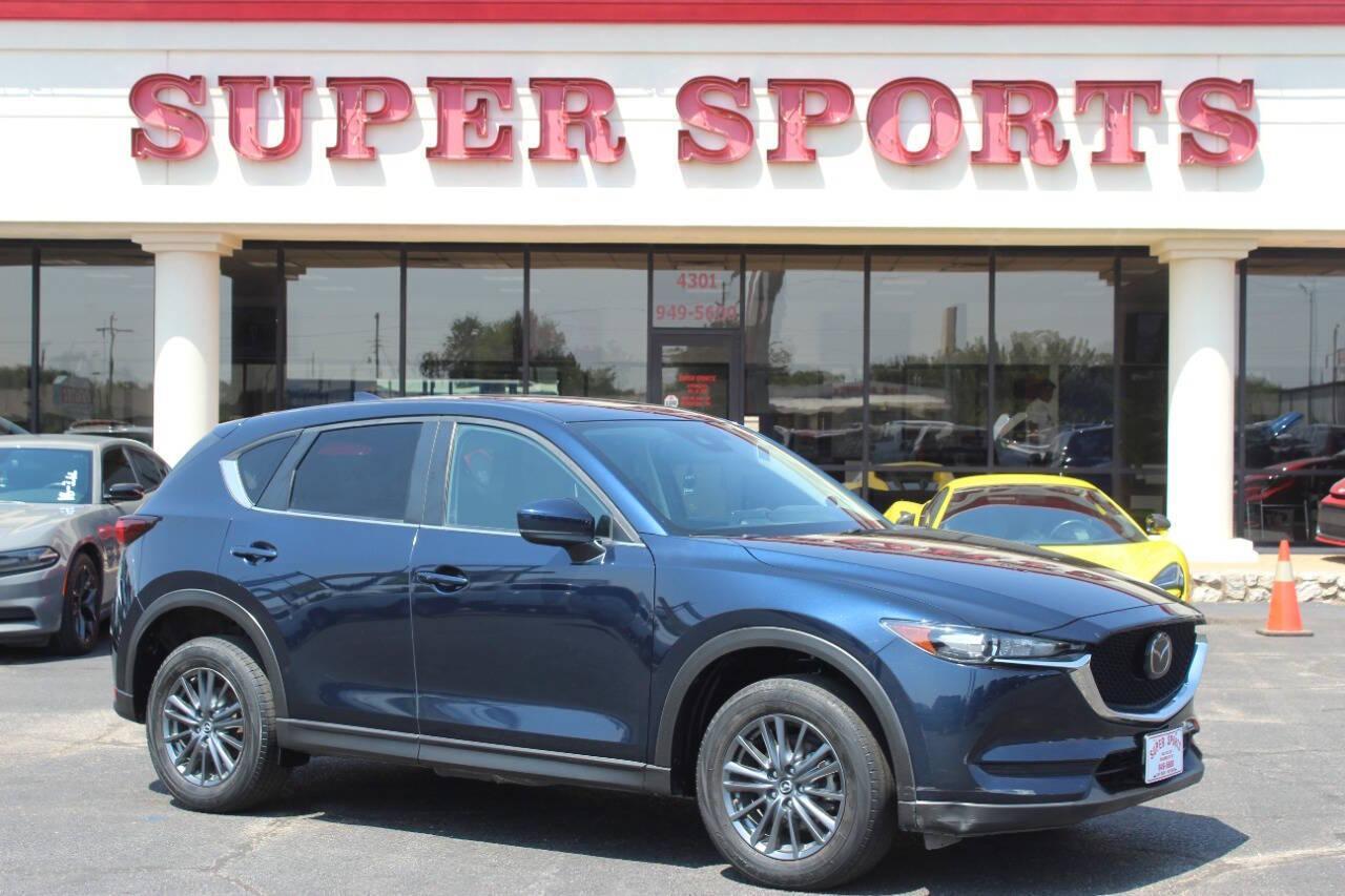 2019 Blue Mazda CX-5 Touring AWD (JM3KFBCMXK1) with an 2.5L I4 2.5L I4 engine, Automatic 6-Speed transmission, located at 4301 NW 39th , Oklahoma City, OK, 73112, (405) 949-5600, 35.512135, -97.598671 - NO DRIVERS LICENCE NO-FULL COVERAGE INSURANCE-NO CREDIT CHECK. COME ON OVER TO SUPERSPORTS AND TAKE A LOOK AND TEST DRIVE. PLEASE GIVE US A CALL AT (405) 949-5600. NO LICENSIA DE MANEJAR- NO SEGURO DE COBERTURA TOTAL- NO VERIFICACCION DE CREDITO. POR FAVOR VENGAN A SUPERSPORTS, ECHE UN - Photo#0