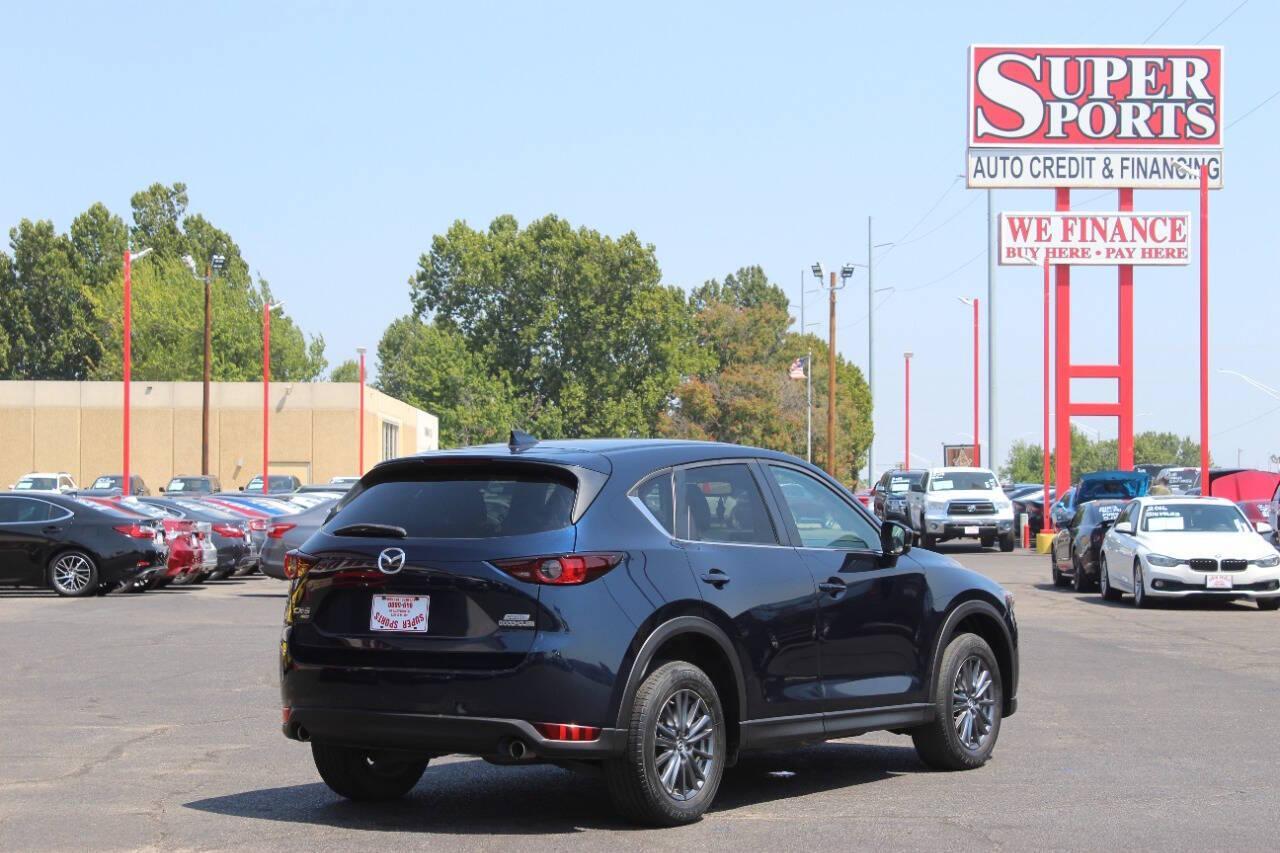 2019 Blue Mazda CX-5 Touring AWD (JM3KFBCMXK1) with an 2.5L I4 2.5L I4 engine, Automatic 6-Speed transmission, located at 4301 NW 39th , Oklahoma City, OK, 73112, (405) 949-5600, 35.512135, -97.598671 - NO DRIVERS LICENCE NO-FULL COVERAGE INSURANCE-NO CREDIT CHECK. COME ON OVER TO SUPERSPORTS AND TAKE A LOOK AND TEST DRIVE. PLEASE GIVE US A CALL AT (405) 949-5600. NO LICENSIA DE MANEJAR- NO SEGURO DE COBERTURA TOTAL- NO VERIFICACCION DE CREDITO. POR FAVOR VENGAN A SUPERSPORTS, ECHE UN - Photo#3
