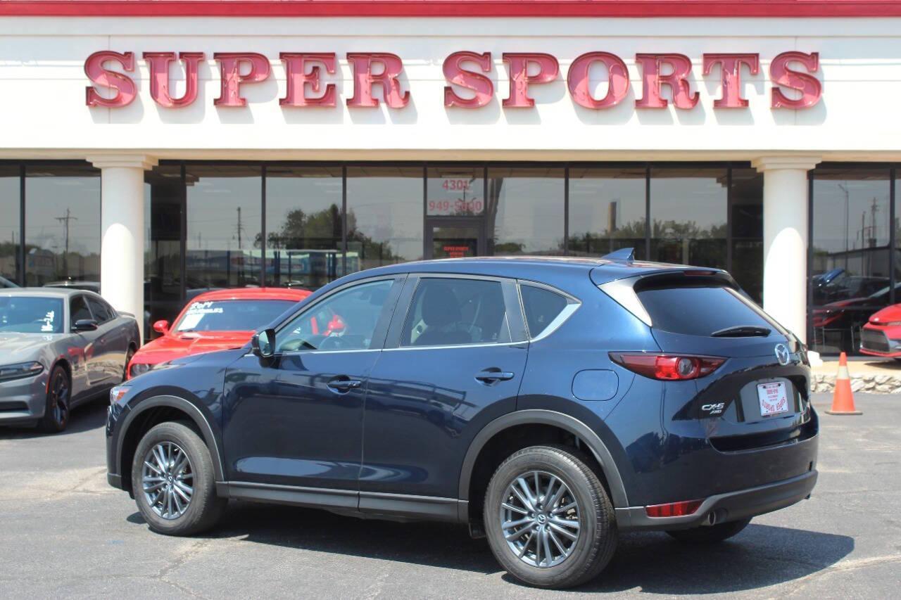 2019 Blue Mazda CX-5 Touring AWD (JM3KFBCMXK1) with an 2.5L I4 2.5L I4 engine, Automatic 6-Speed transmission, located at 4301 NW 39th , Oklahoma City, OK, 73112, (405) 949-5600, 35.512135, -97.598671 - NO DRIVERS LICENCE NO-FULL COVERAGE INSURANCE-NO CREDIT CHECK. COME ON OVER TO SUPERSPORTS AND TAKE A LOOK AND TEST DRIVE. PLEASE GIVE US A CALL AT (405) 949-5600. NO LICENSIA DE MANEJAR- NO SEGURO DE COBERTURA TOTAL- NO VERIFICACCION DE CREDITO. POR FAVOR VENGAN A SUPERSPORTS, ECHE UN - Photo#4